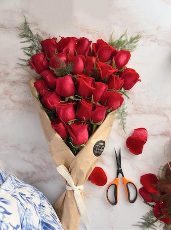 Love me tender - Red roses are recognized queens of the flower world. Passionate and sensual, they will be a wonderful gift for any celebration. A classic bouquet of 24 red roses with greenery. Packed in fancy paper with ribbon. It looks elegant!