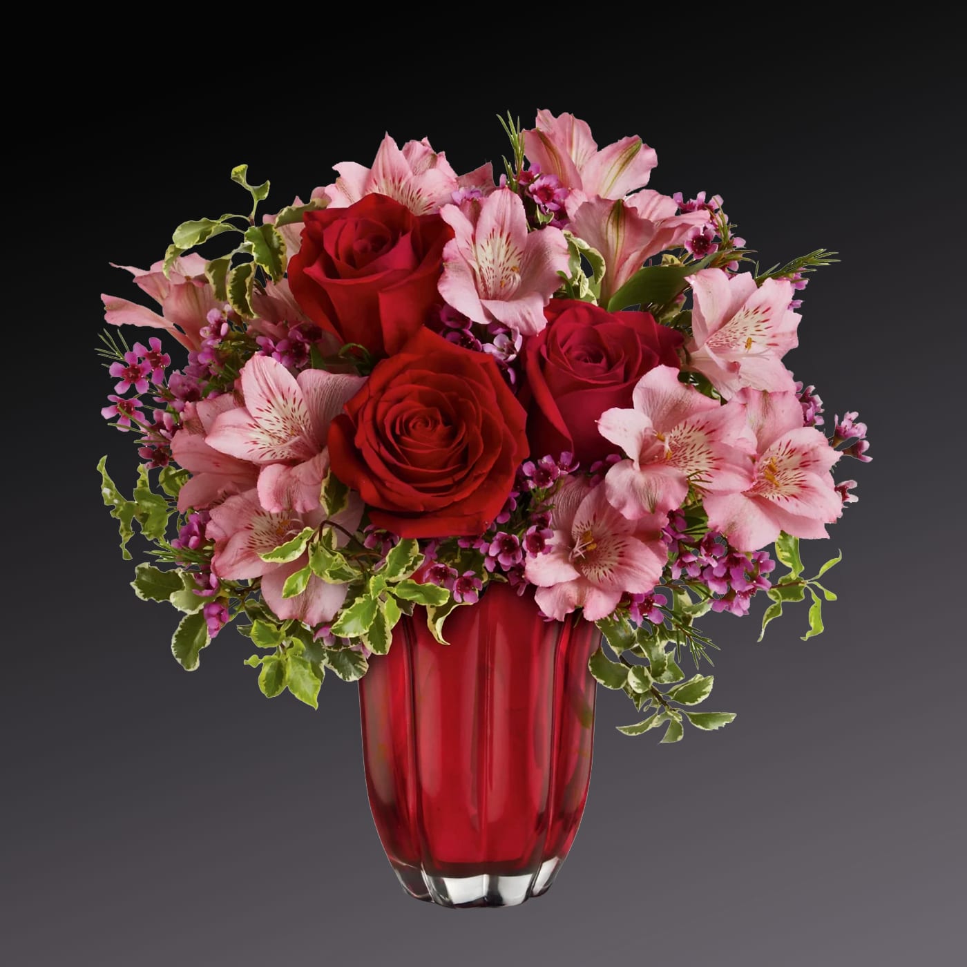 Heart's Treasure Bouquet by Teleflora - Love is in bloom! This gorgeous and romantic bouquet features deep red roses and other flowers, artfully arranged in a striking, petal-shaped glass vase.