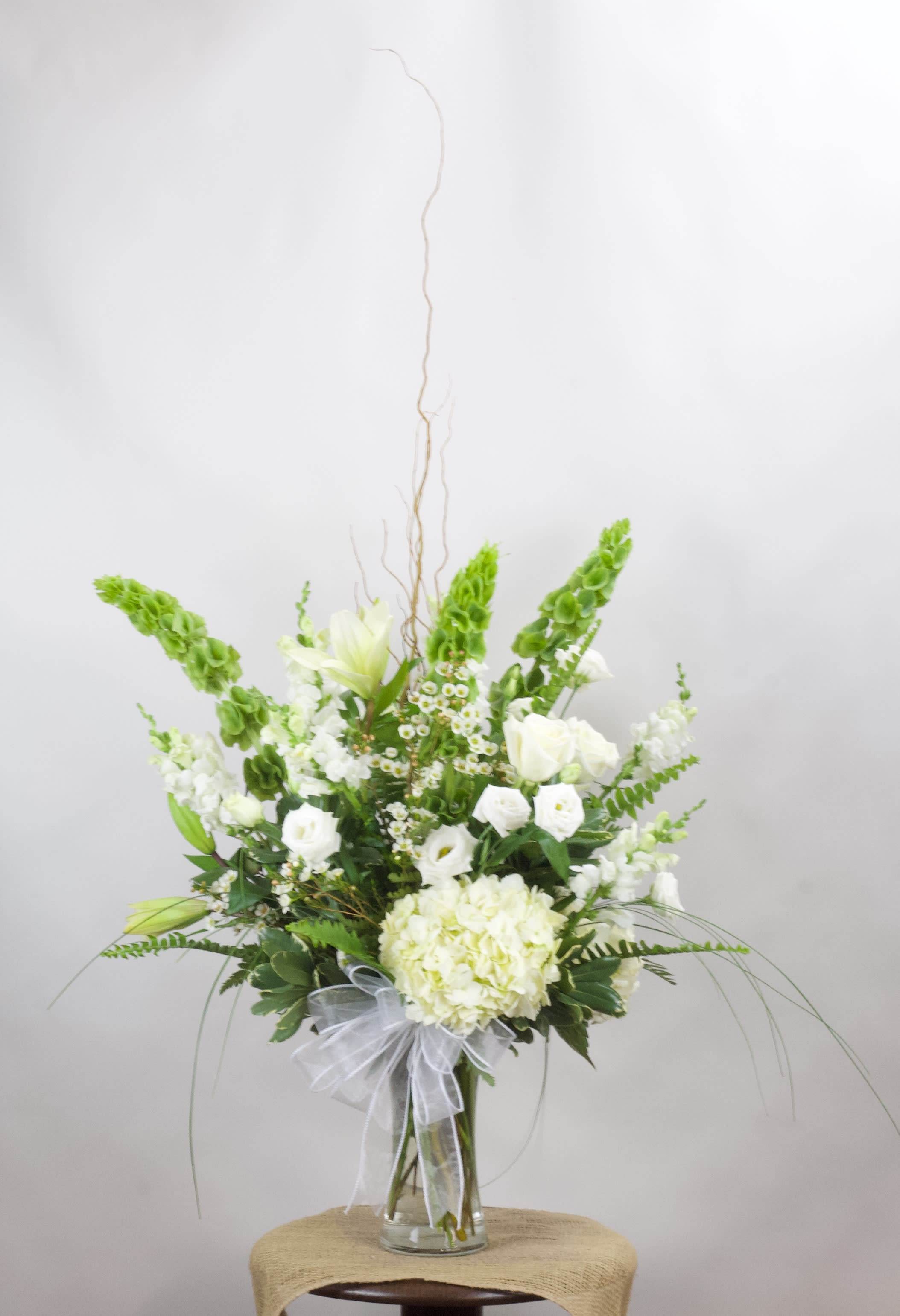 Elegance - All white arrangement with hydrangea, lilies, lisianthus, and more.
