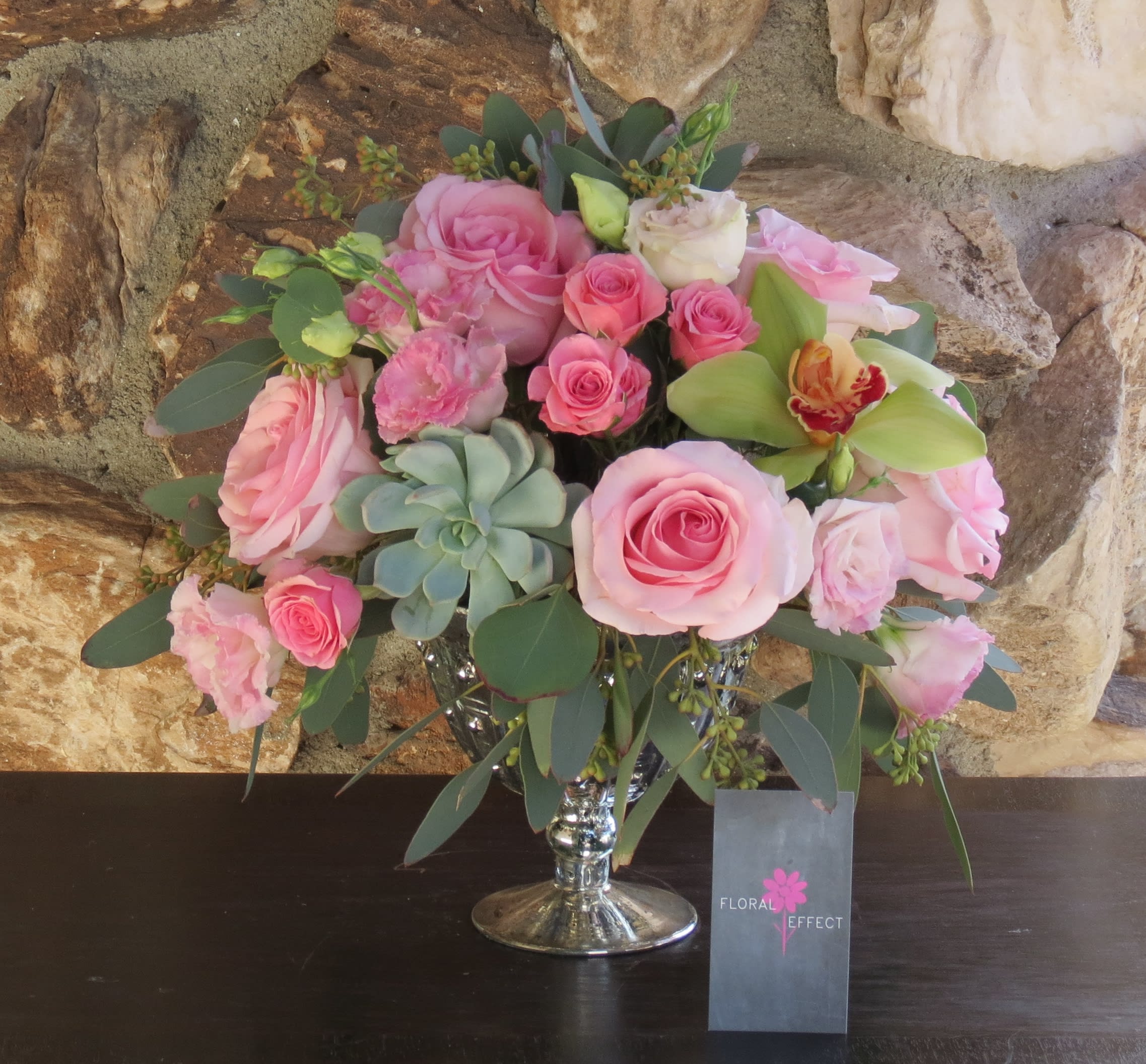 Pink roses, succulents, and cymbidiums - Pink roses, succulents, and cymbidiums arranged on a beautifull silver vase.