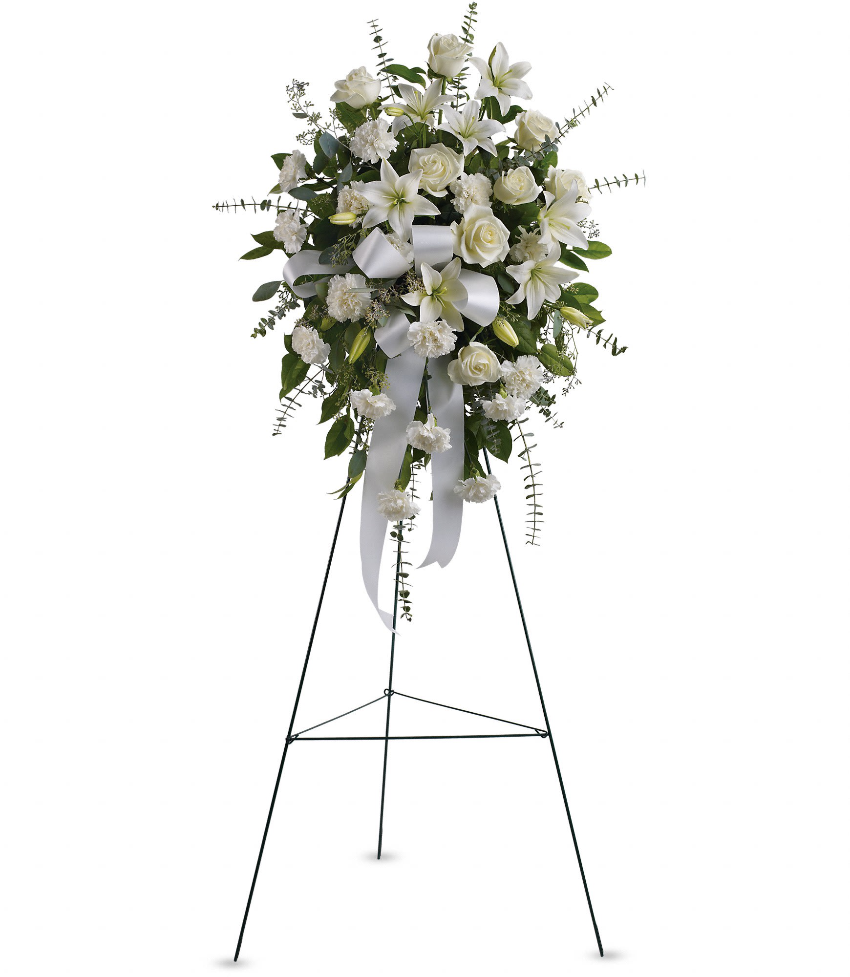 Sentiments of Serenity Spray  - Beautifully simple, this lovely spray of white roses, lilies and carnations decorated with white satin ribbon is a tasteful way to express your sympathy. T262-1A. 