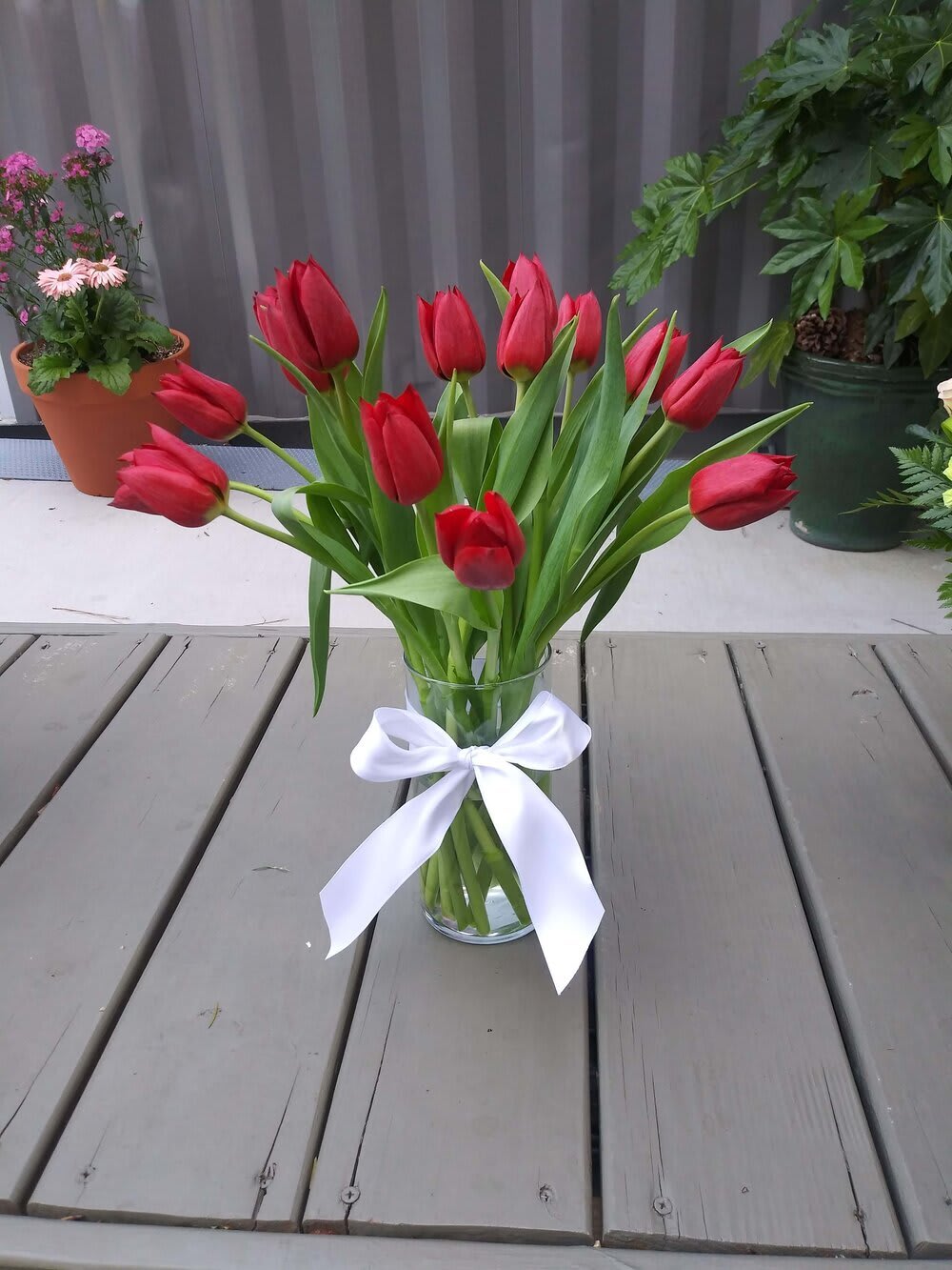Royal Tulip Bouquet - A clear vase with tulips (your choice of color). Wrapped style is available.