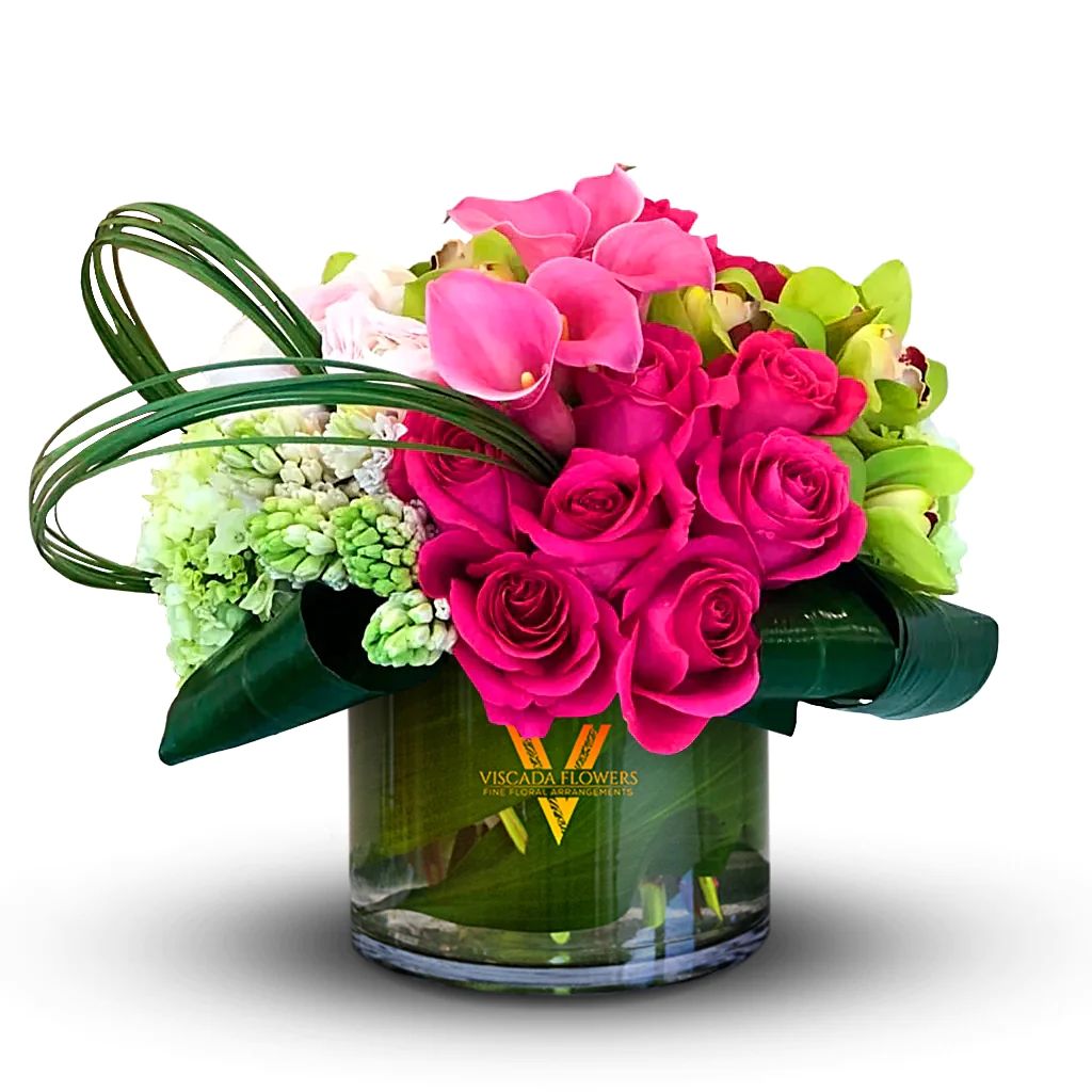 Pretty In Pink - This charming bouquet showcases pink blooms and lush greens, adding a touch of feminine charm and natural beauty. Perfect for creating an enchanting ambiance.