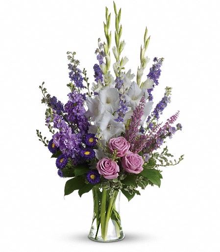 T251-1A Joyful Memory T251-1A Joyful Memory - Lavender and white sympathy flowers make a grand statement in this joyful bouquet. Cherish your memories with this lasting remembrance of lavender larkspur and roses, deep purple asters, pure white gladioli and the softest pink heather. A classic assortment of flowers such as lavender larkspur, stock and roses, plus purple asters, white gladioli and pink heather. Approximately 20" W x 32" H