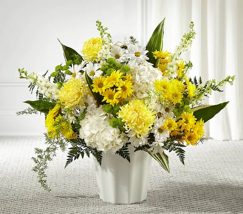 Unity and Grace Floor Basket - Every bloom in our Unity &amp; Grace Floor Basket reminds us of the brightness of their spirit. This stunning arrangement features an uplifting mix of hydrangea, larkspur, daisy pompons and mums.