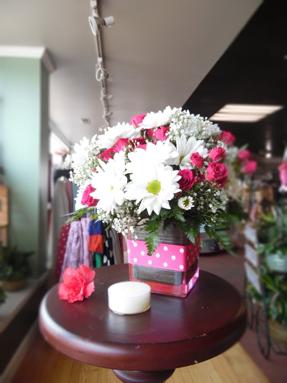 Teleflora's  Pink Polka Dots and Posies - Polka dots and posies, White Daisies and Pink spray roses they're the perfect pair. Well, at least in this pretty arrangement they are. Just the right flowers in just the right vase all wrapped up in you guessed it, just the right ribbon. 