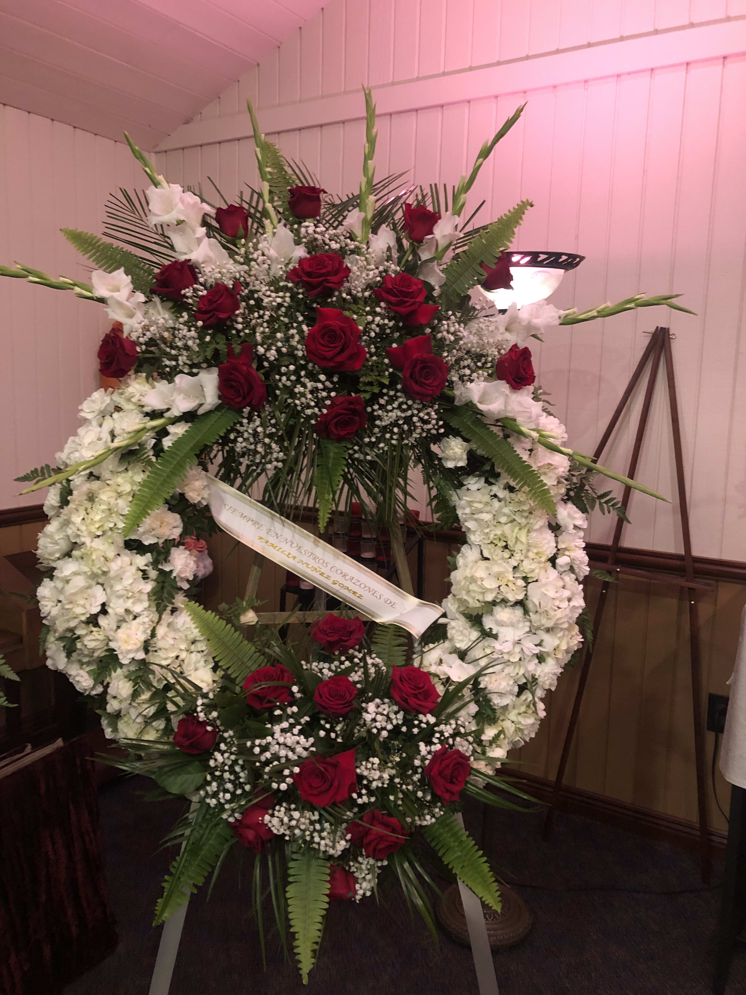 LARGE DOUBLE ARRANGEMENT WREATH LARGE DOUBLE ARRANGEMENT WREATH - 2 ARRANGEMENTS ON A WREATH.  COMES IN LARGE CAN BE DONE SMALLER IF DESIRED. CARNATIONS MUMS ROSES AND GLADIOLAS