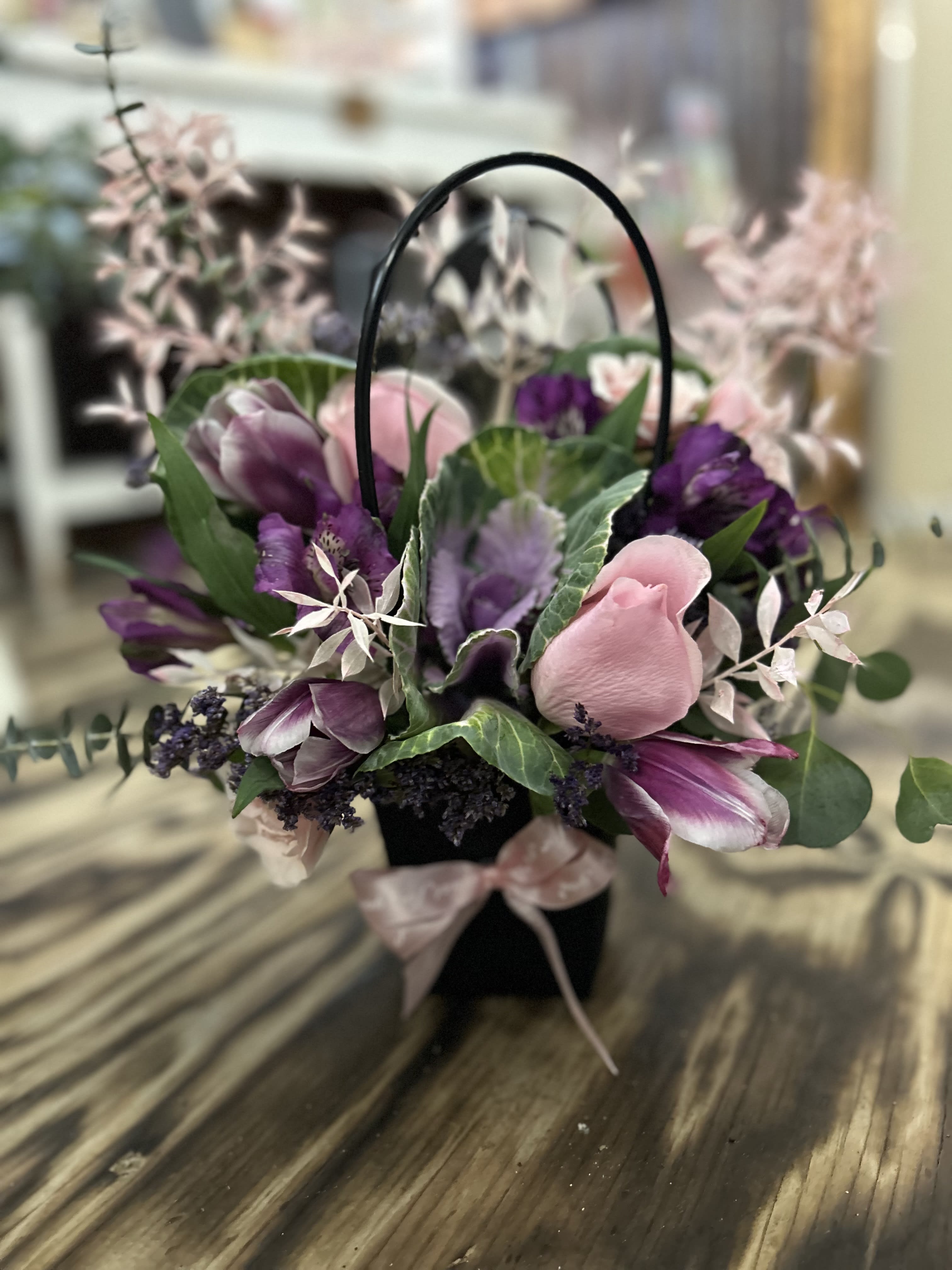 Purple Haze Purse Arrangement - Purple Purple &amp; Purple. Such a cute gesture that wont break the bank but cute &amp; unique. Flower arrangement for any occasion!  **NOTE: Flowers and shades of purple can vary due to season and availibility but will be same look and value.