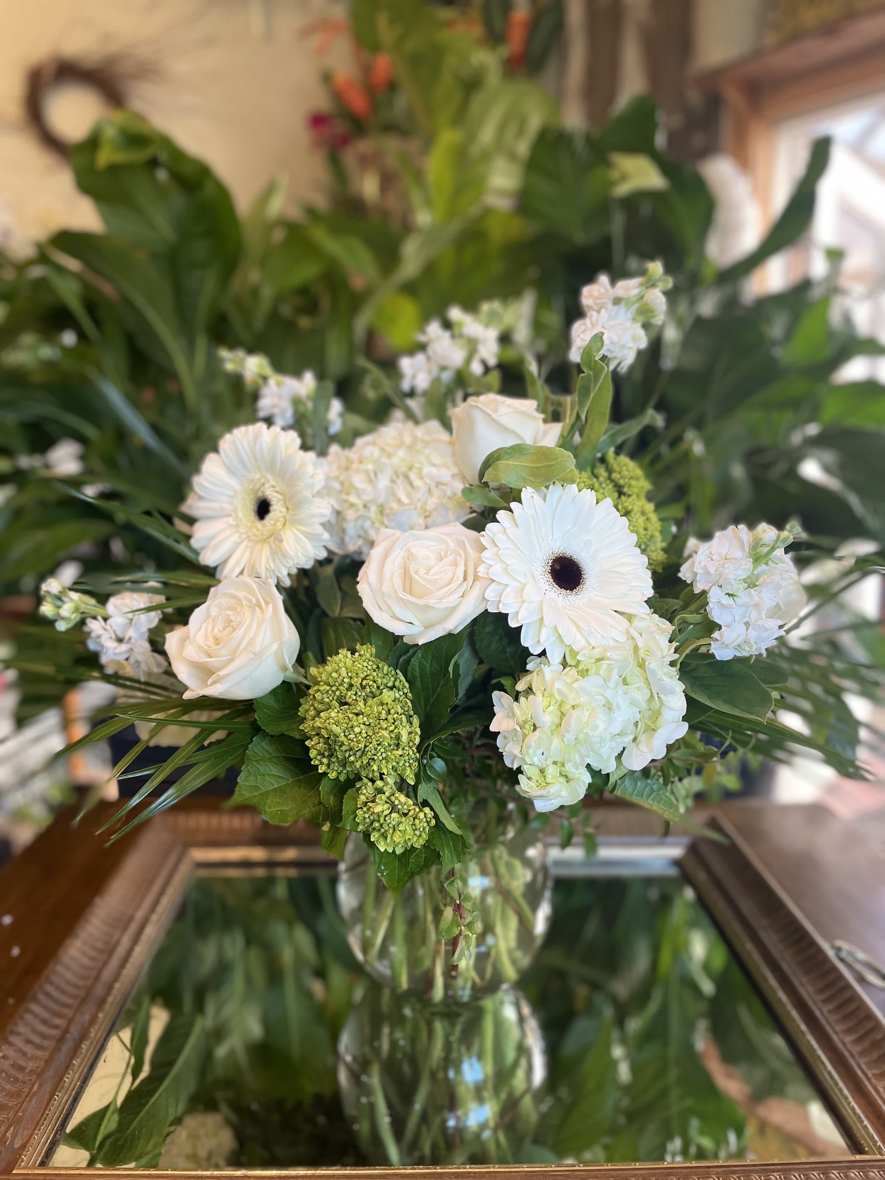 In The Limelight In The Limelight - Bright white gerbera daisies and limelight hydrangeas, make this the perfect arrangement for the flower lover in your life.