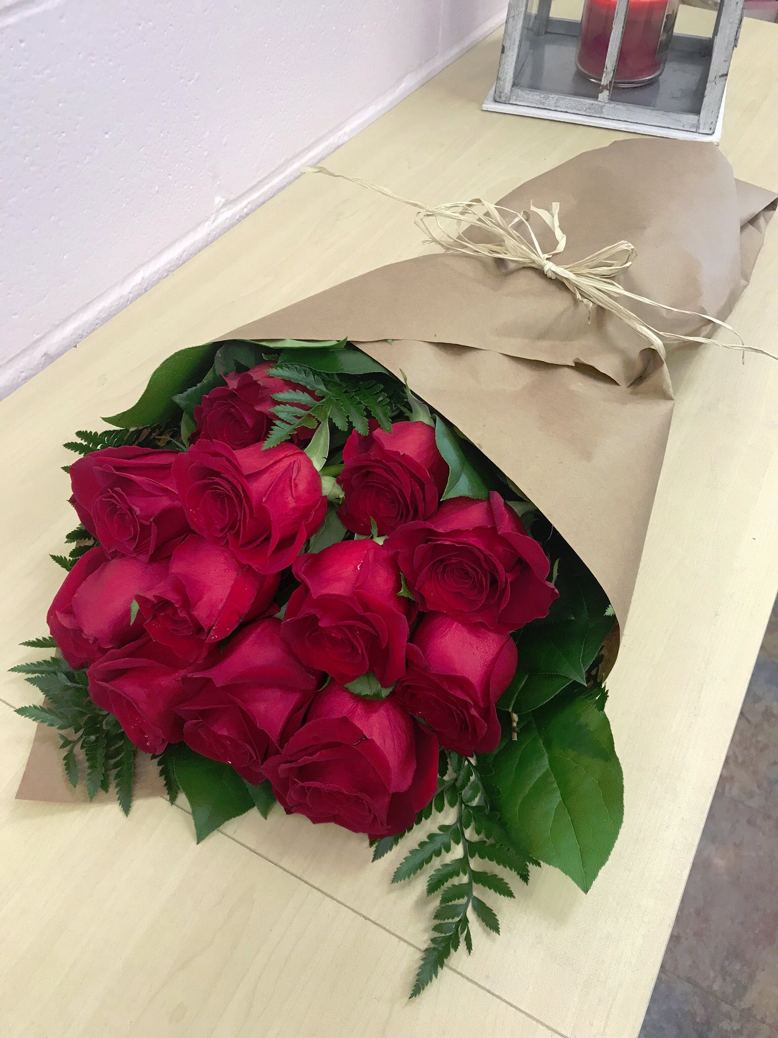 Roses Wrapped in Paper Roses Wrapped in Paper - Beautiful bouquet of fresh roses wrapped in paper for the convenience of travel or use for your special occasion.