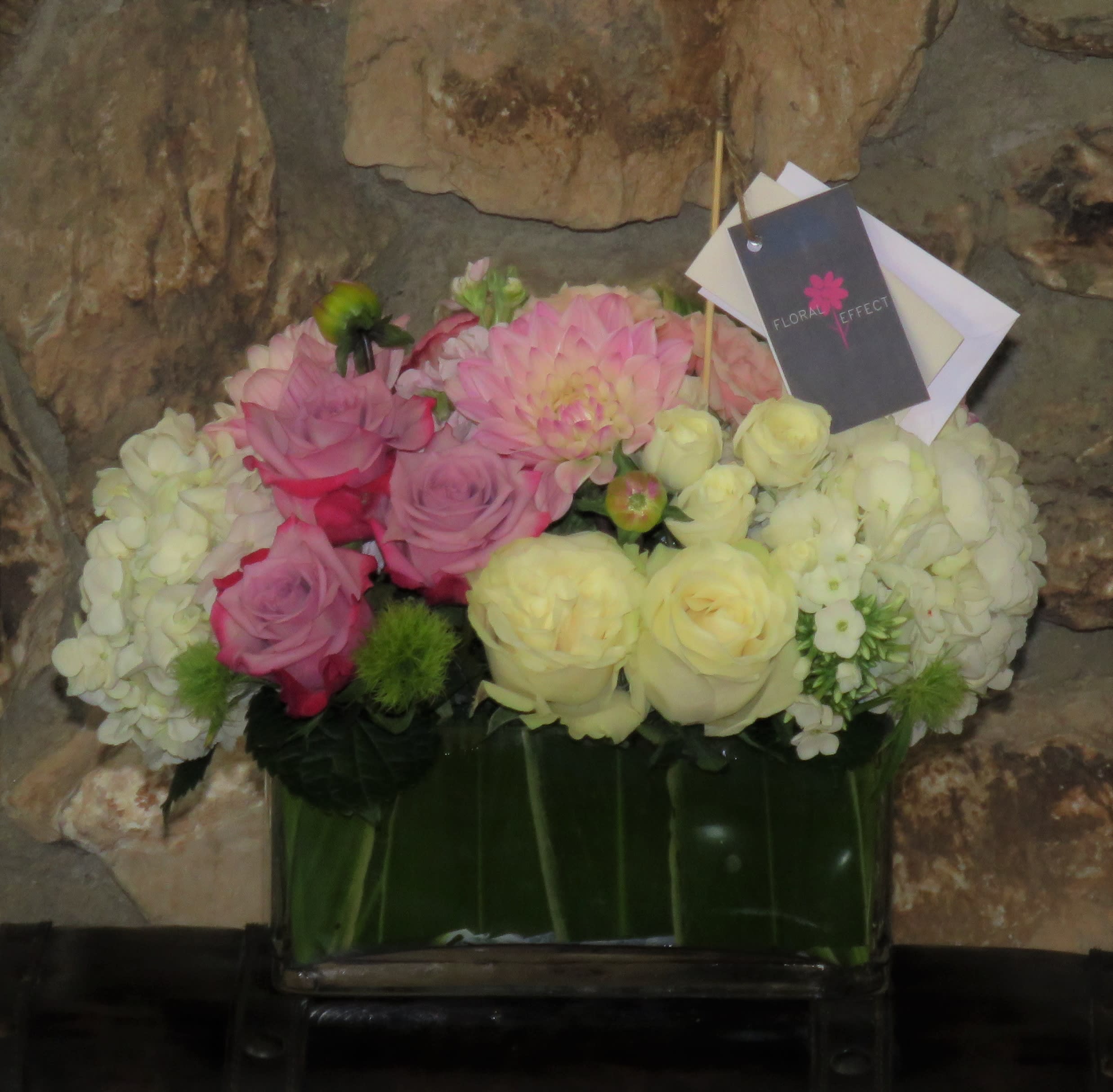 White and Lavander Roses White and Lavander Roses - A beautiful mixture of roses, hydrangeas, with seasonal flowers arranged in a glass vase
