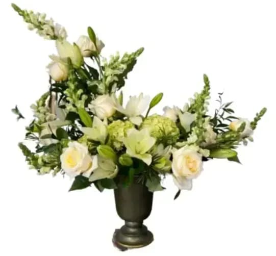 Peaceful Sympathy Frazier's Version - A beautiful, heartfelt arrangement made with a variety of whites and greens, including roses, lilies and snapdragons, along with fresh greenery. A lovely, soft arrangement to honor any loved one.