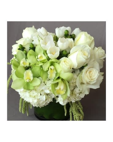 Creamy white garden of roses Creamy white garden of roses - Soft creame roses, green cymbidium orchids, combined with with white tulips and draping green amaranthus. This full, sophisticated design is great for any occasion. Product ID: DF-1011