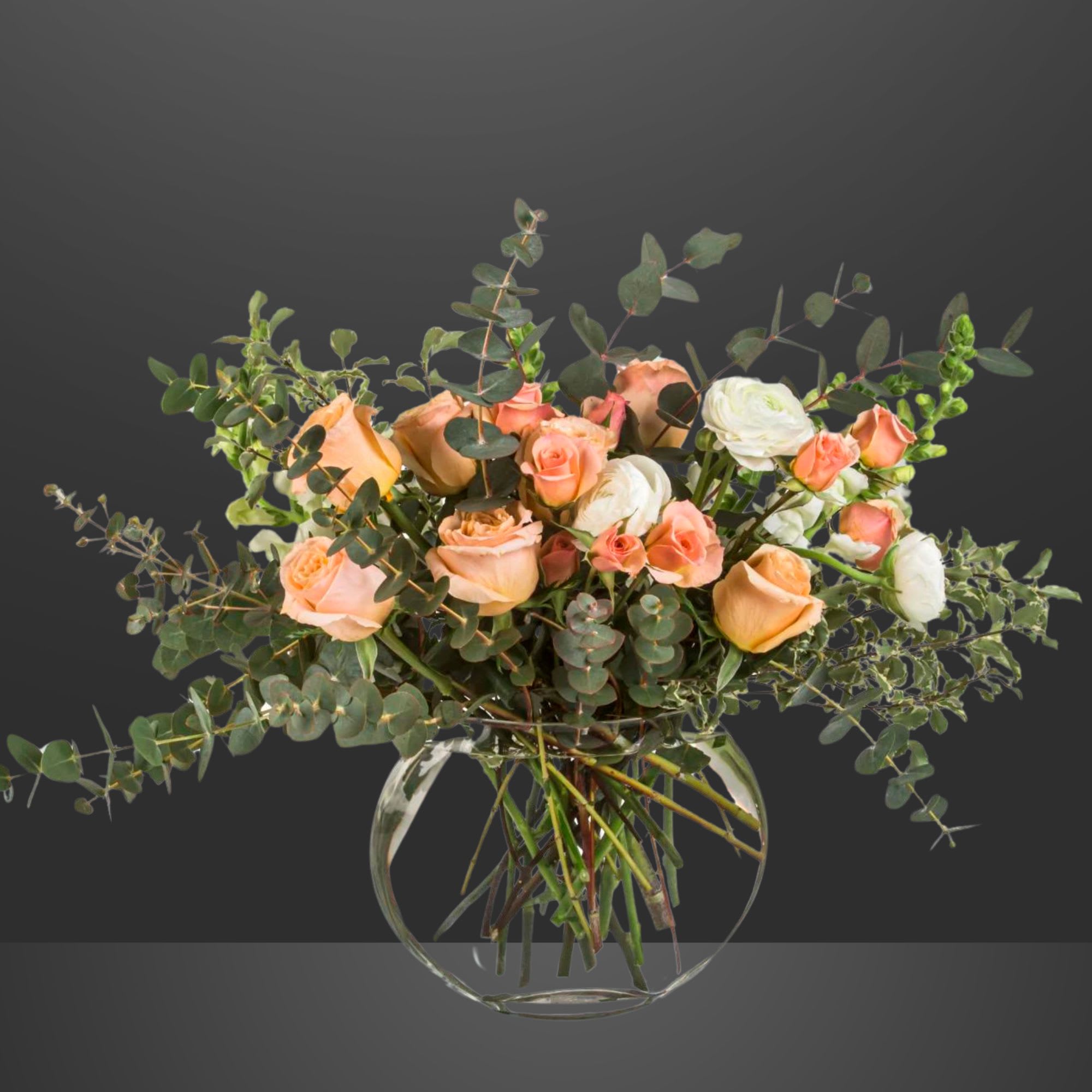 Peach Perfection - Gimme Some Sugar is the most whimsical way to sweeten somebody's day. This beautiful boho arrangement with eucalyptus, peach and white blooms, in a moon shaped vase elevates any space. Perfect for Women's Day, Mother's Day, or any birthday.   All of Zalea's arrangements are designed with the freshest ingredients. If we happen to be out of a type of bloom, or a color (or if they're not the freshest), our team will reach out to let you know what the substitution options are! Substitutions can happen with all fresh product - so we make sure you have the freshest possible arrangements.  APPROXIMATE DIMENSIONS: 22&quot; W x 20&quot; H