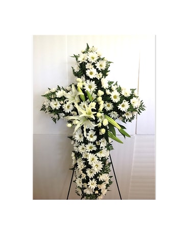 Daisies & Lilies Cross Daisies & Lilies Cross - Standing cross of white lilies and daisies, with a touch of white spray roses. 36'' cross form, approx. 38''x24'' Flowers and colors are subject to change depending on availability. FCF-SYMC01