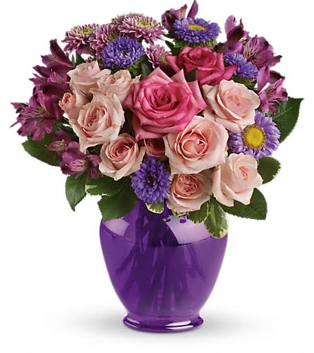 Teleflora's Purple Medley Bouquet with Roses - Impress someone special without depressing your budget. Send lush pink and lavender flowers in a classic purple ginger jar. The exquisite bouquet includes hot pink roses light pink roses lavender alstroemeria lavender matsumoto asters and lavender cushion spray chrysanthemums accented with fresh greenery.Delivered in a deep purple ginger jar vase made of durable high-quality plastic.Approximately 11 1/2&quot; W x 13&quot; H Orientation: One-Sided As Shown : TEV04-3ADeluxe : TEV04-3BPremium : TEV04-3C