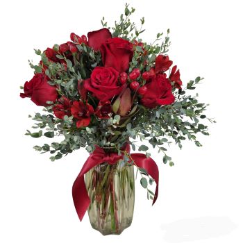 Cherished - For that cherished individual in your life...the overpowering feeling of love with this all red arrangement.  In a clear vase the red flowers shown are the red rose, red hypericum and red alstromeria...accented with eucalyptus.