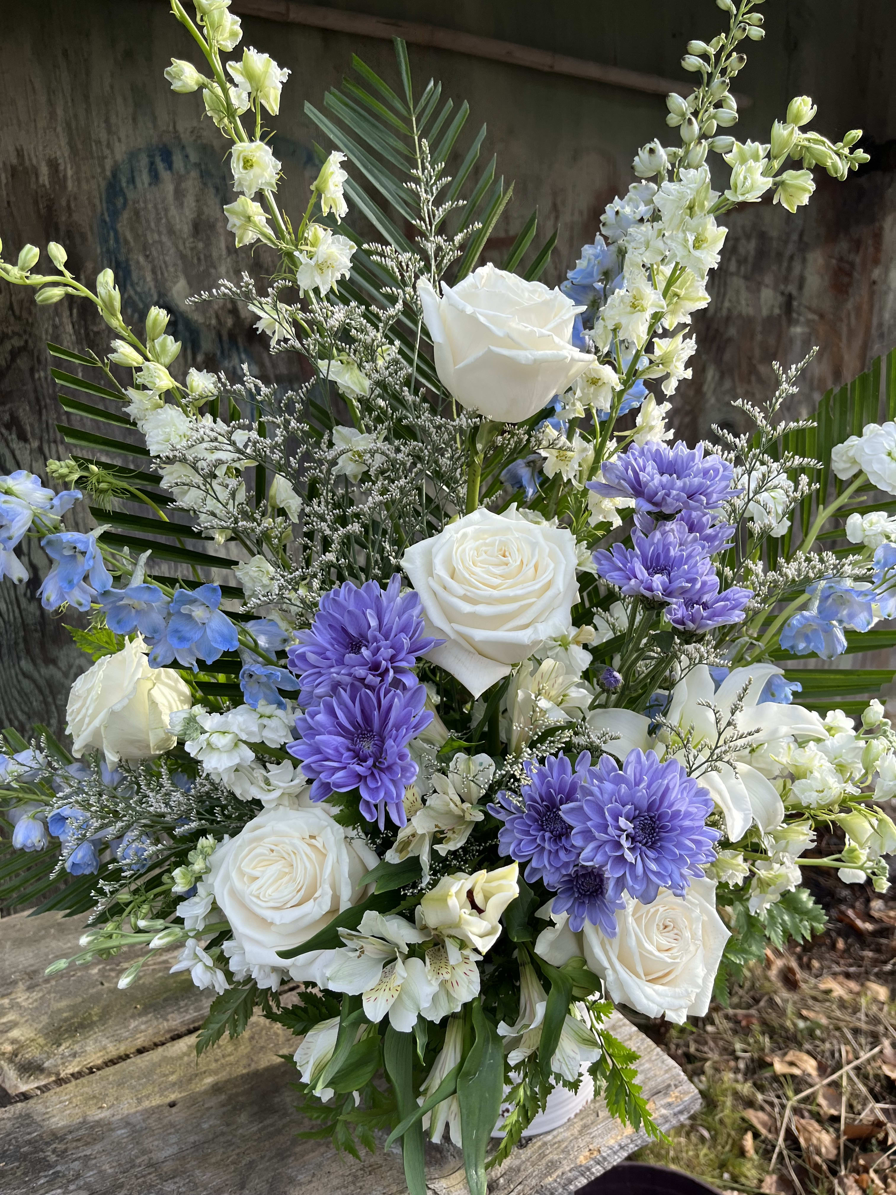By the Sea - Tall vase arrangement with creams and blues made up with roses, delphinium, and alstroemeria 