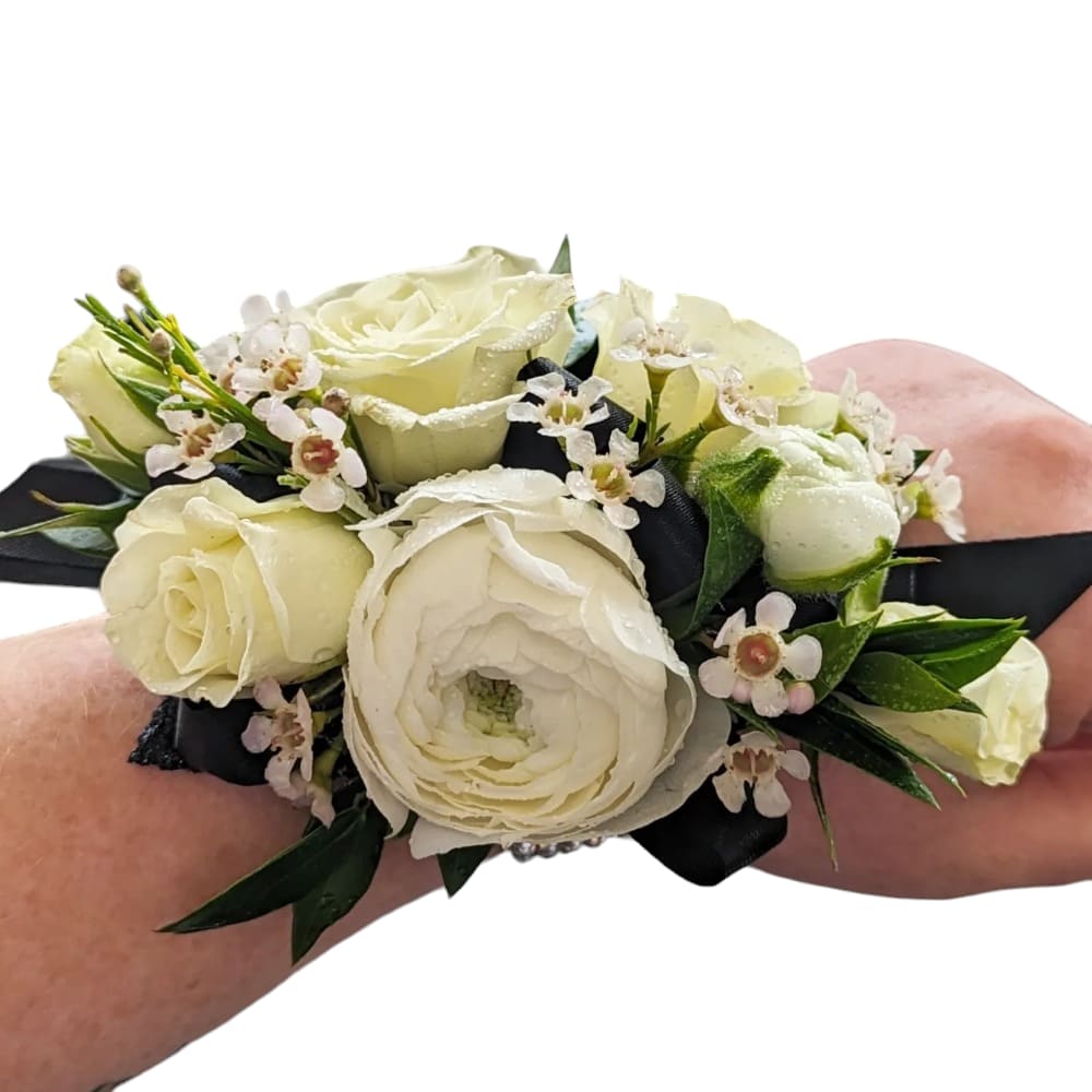 Wrist Corsage by Art &amp; Flowers - A classic wristlet corsage with a rhinestone bracelet, available in silver, gold and black gem stones. This wrist arrangement looks good with any outfit. A perfect compliment to any prom, formal, or wedding event. We style these in your choice of color and accessories. 