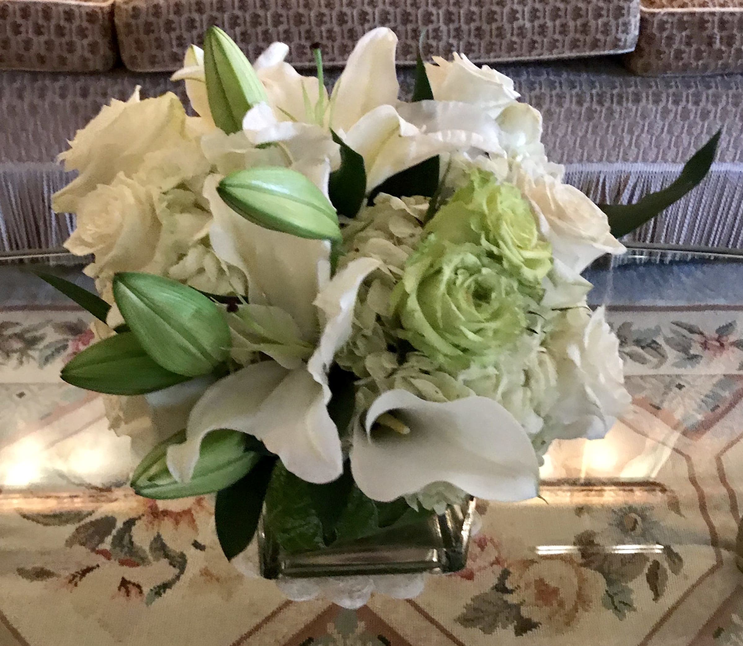 Custom arrangement of white hydrangea, white Roses, Casablanca lilies &amp; white calla lilies - Custom arrangement of white hydrangea, white Roses, white Casablanca lilies, white calla lilies &amp; green roses in clear glass cube.