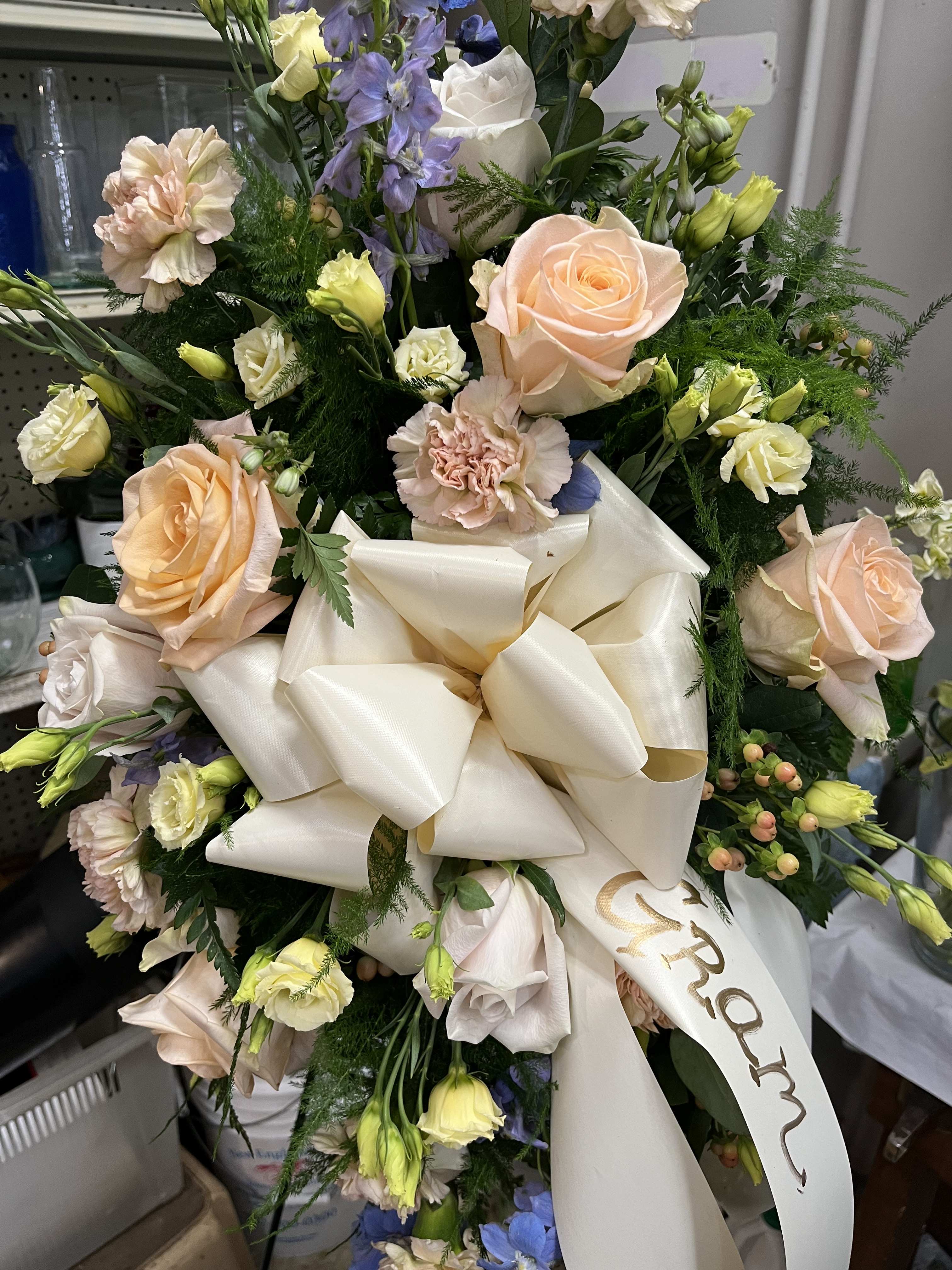 Standing Custom Spray  - Standing Spray with customizable ribbon for your loved ones. Made with roses, spray roses, and carnations 