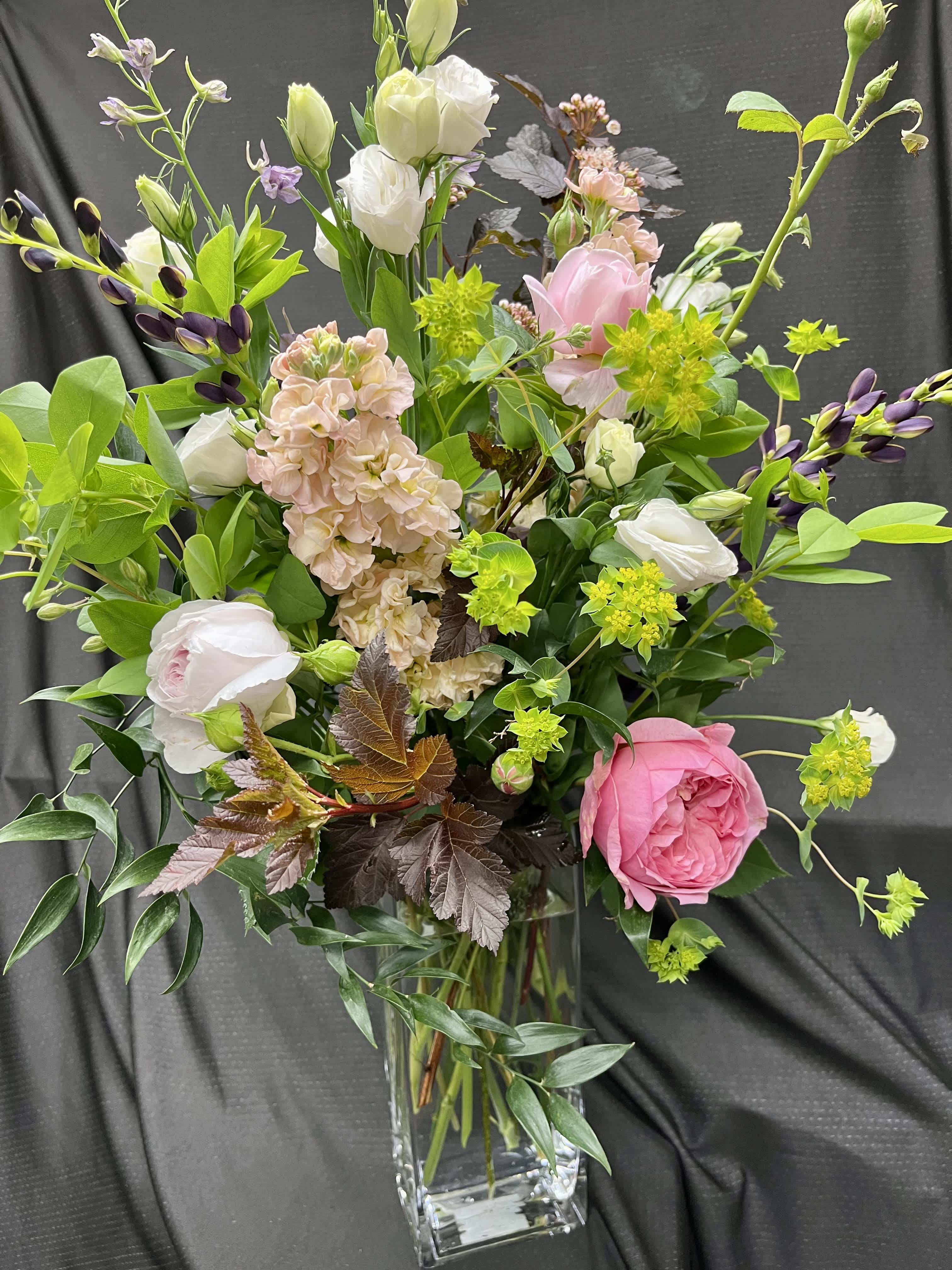 Touch of Pink - Tall vase arrangement with stock, roses, lisianthus, and lupine. 