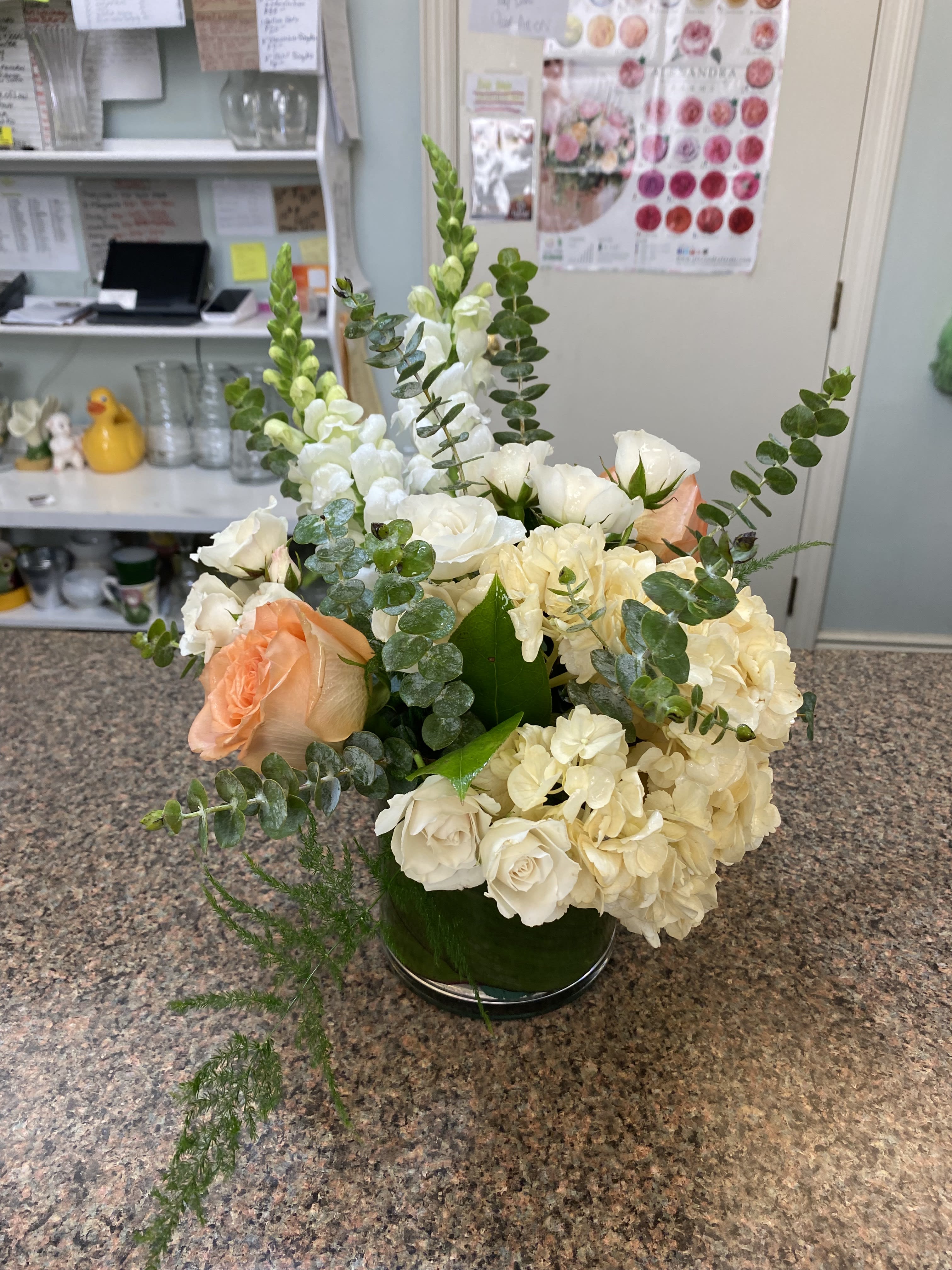 Peaches and Cream - Delicate white spray roses mixed with peach roses and creamy hydrangea make an elegant statement in this modern look.