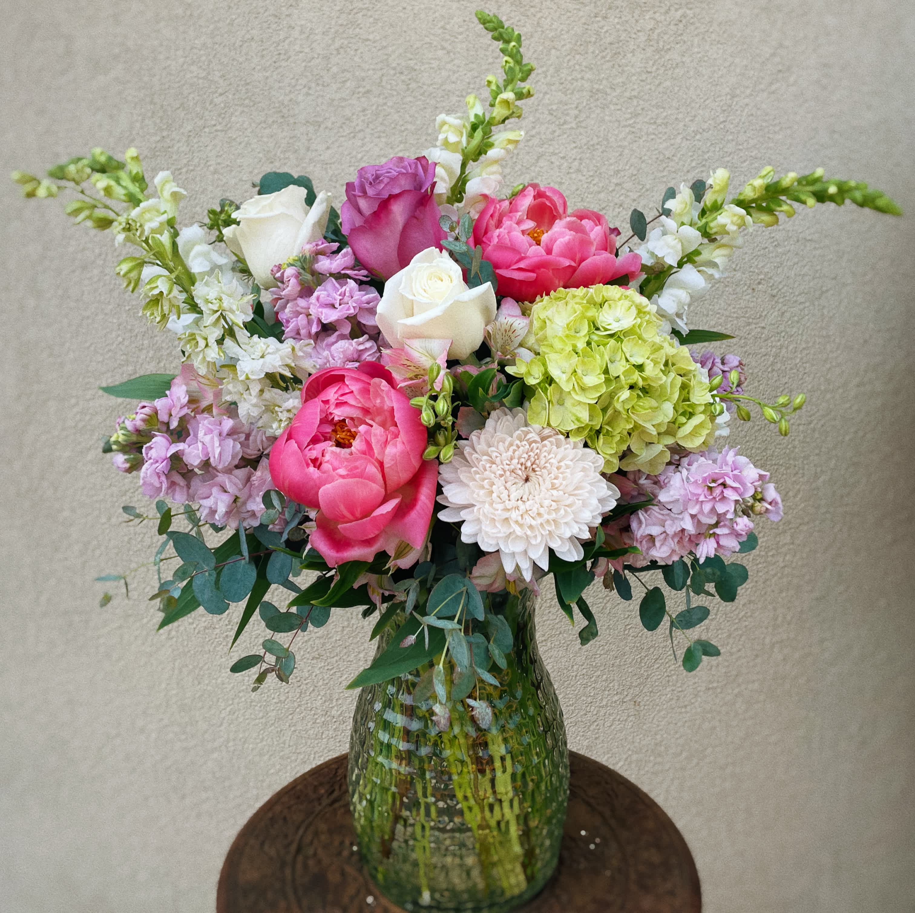 Cosmopolitan - This arrangement has peony, roses, stock, snapdragon and so much more.