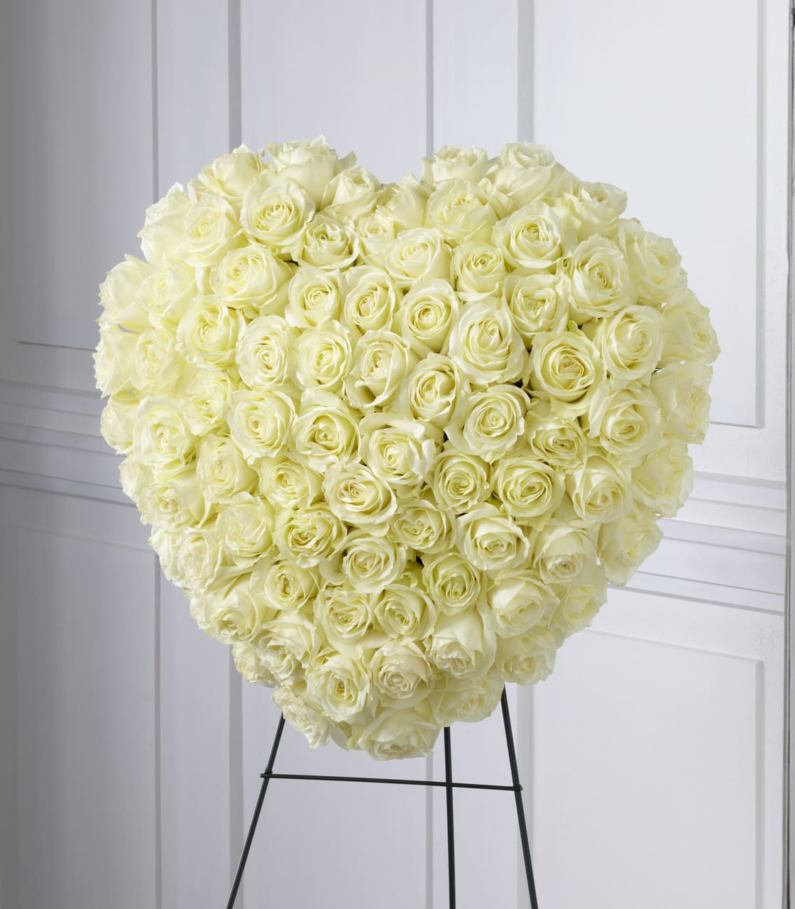 SAFF The Elegant Remembrance Standing Heart - The Elegant Remembrance Standing Heart is an exquisite display of peace and love. 77 Stems of white roses are artfully arranged in the shape of a heart and presented on a wire easel, creating a simply beautiful tribute for their final farewell service. Approximately 24&quot;H x 22&quot;W.  Your purchase includes a complimentary personalized gift message.