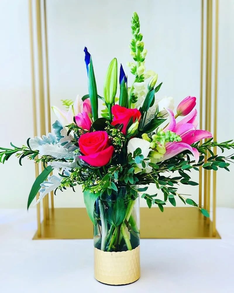 Lilie's Springtime Bouquet - fresh premium bouquet in our signature vase may include any of the following: iris, tulips, ranunculus, roses, snapdragons and lisianthus with fancy greenery