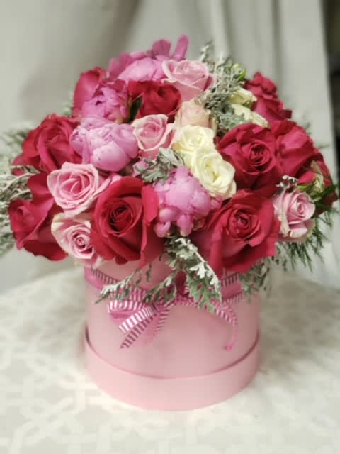 Pink perfection box - A full box of premium pink flowers arranged.