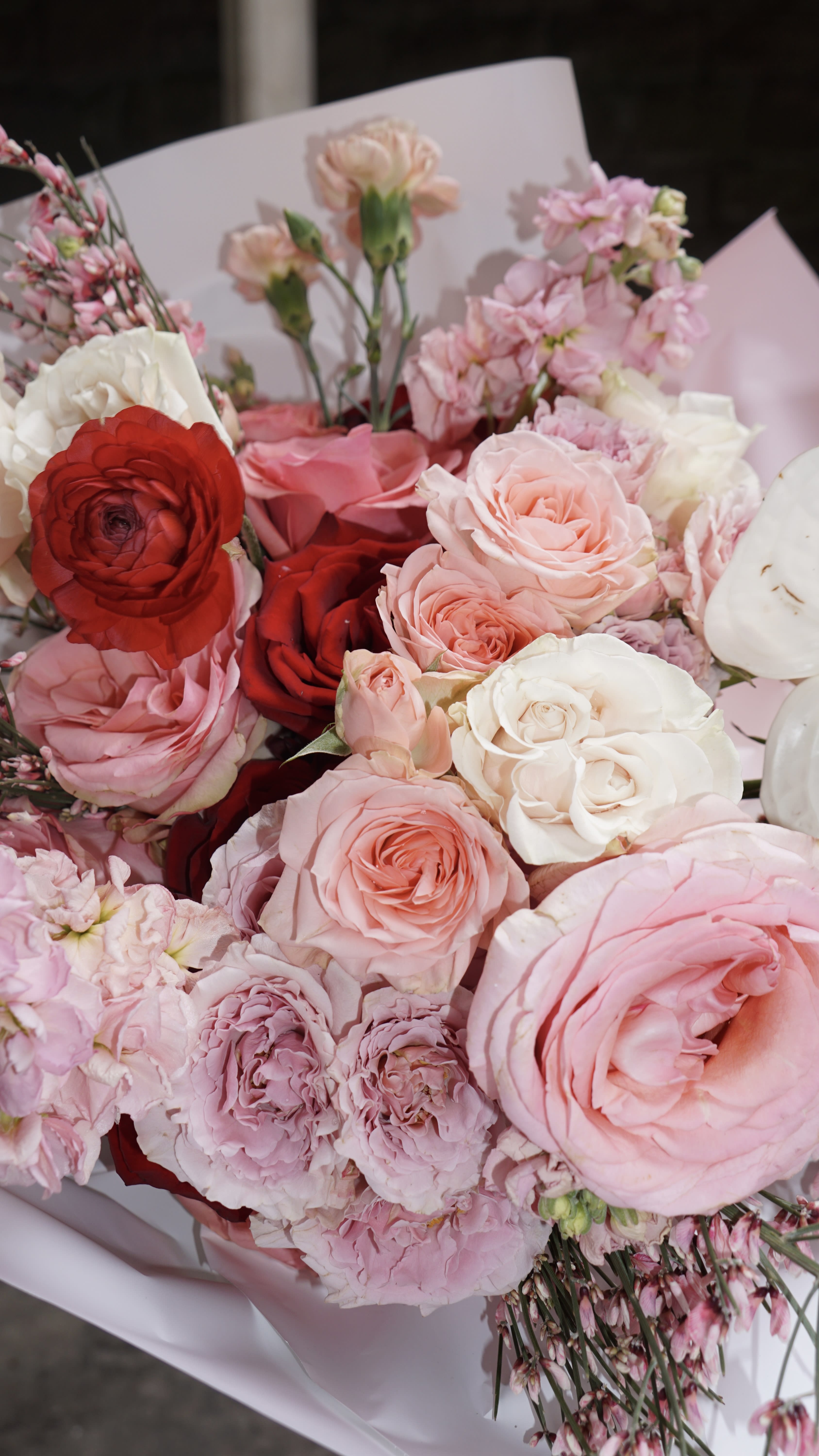 My Pretty Baby Bouquet - Introducing our enchanting flower bouquet, a vibrant celebration of color and charm. Comprising up to 40 stems of assorted pink, red, and white flowers, each bloom is a testament to nature's beauty. Delicately wrapped in crisp white paper, this bouquet is a visual symphony that effortlessly brightens any space. Perfect for expressing love, joy, or admiration, these blossoms offer a diverse and stunning arrangement that appeals to the heart. Elevate your moments with this kaleidoscope of nature's finest hues.