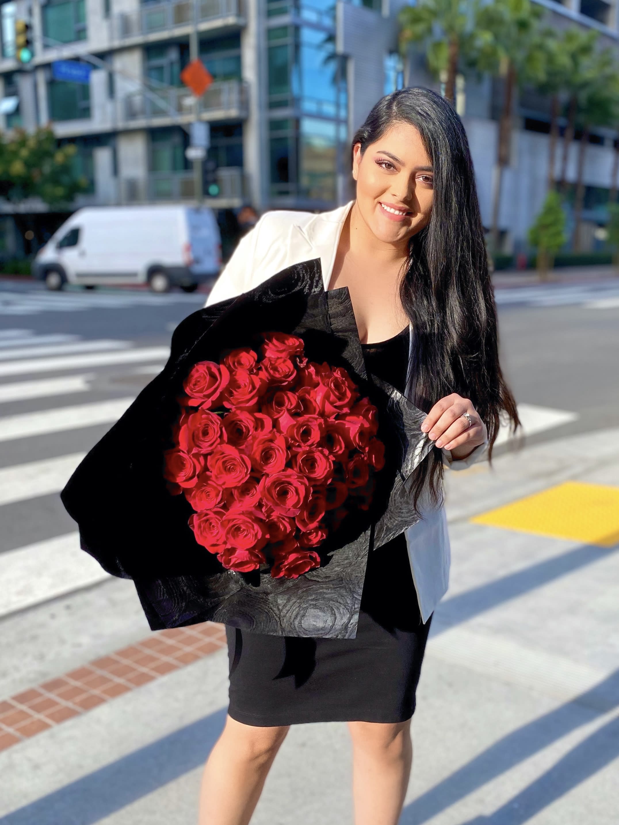 Amor De Mis Amores - 100 Red Roses wrapped in our prestige black paper.   Tall stems  Vase not included