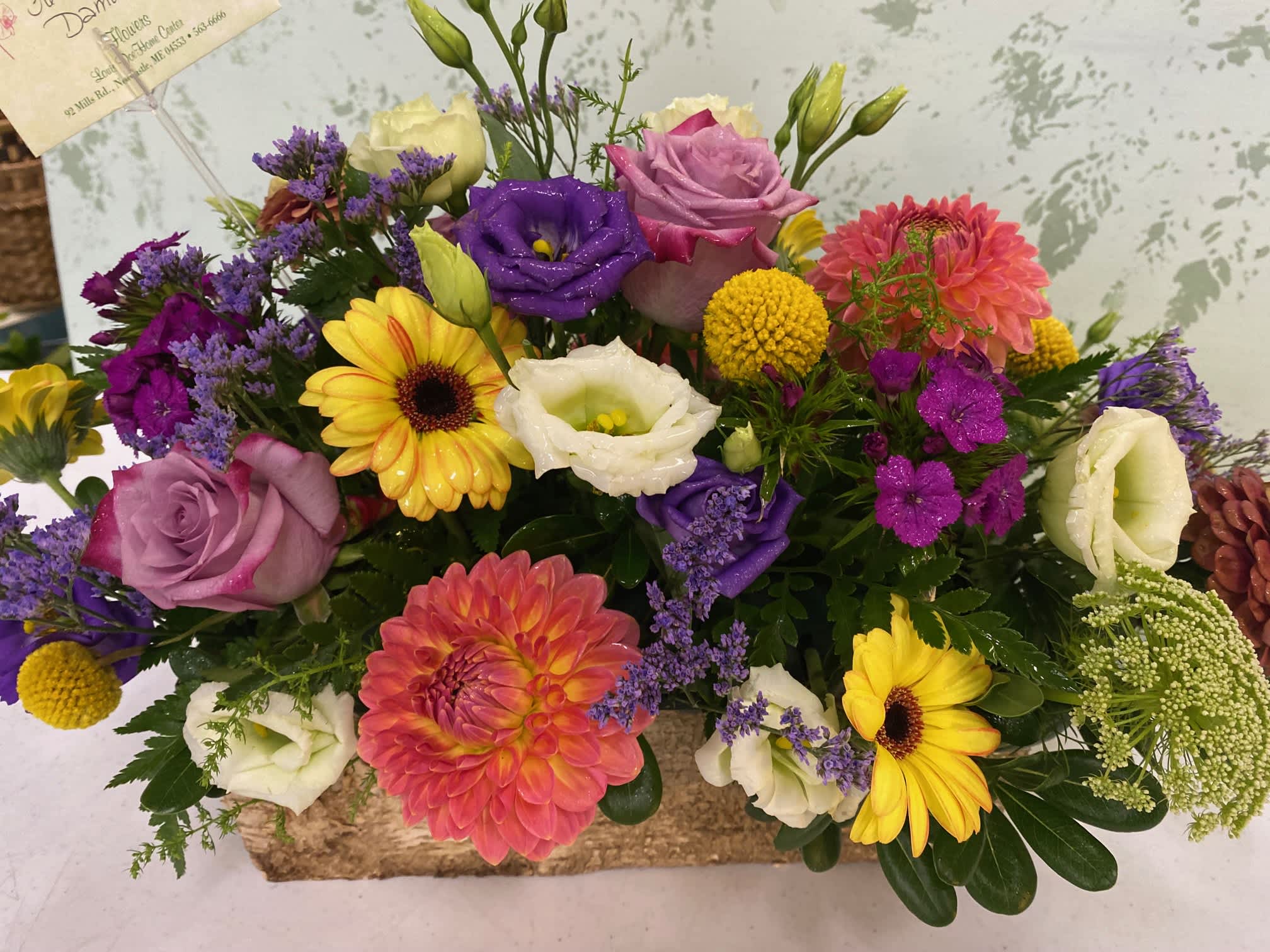 Summertime fun - Birch container arrangement made with dahlias, roses, lisianthus, and mixed summer flowers. 