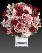 Teleflora's Love That Pink Bouquet with Roses - Think pink, then think of all the thank-you kisses you'll get when you send this ravishingly romantic bouquet. Lush pink and red roses, pink alstroemeria and pink carnations in a chic mirrored silver cube. Get ready to pucker up. This impressive bouquet includes pink roses, red spray roses, pink alstroemeria and pink carnations accented with assorted greenery. Delivered in a mirrored silver cube. Orientation: All-Around