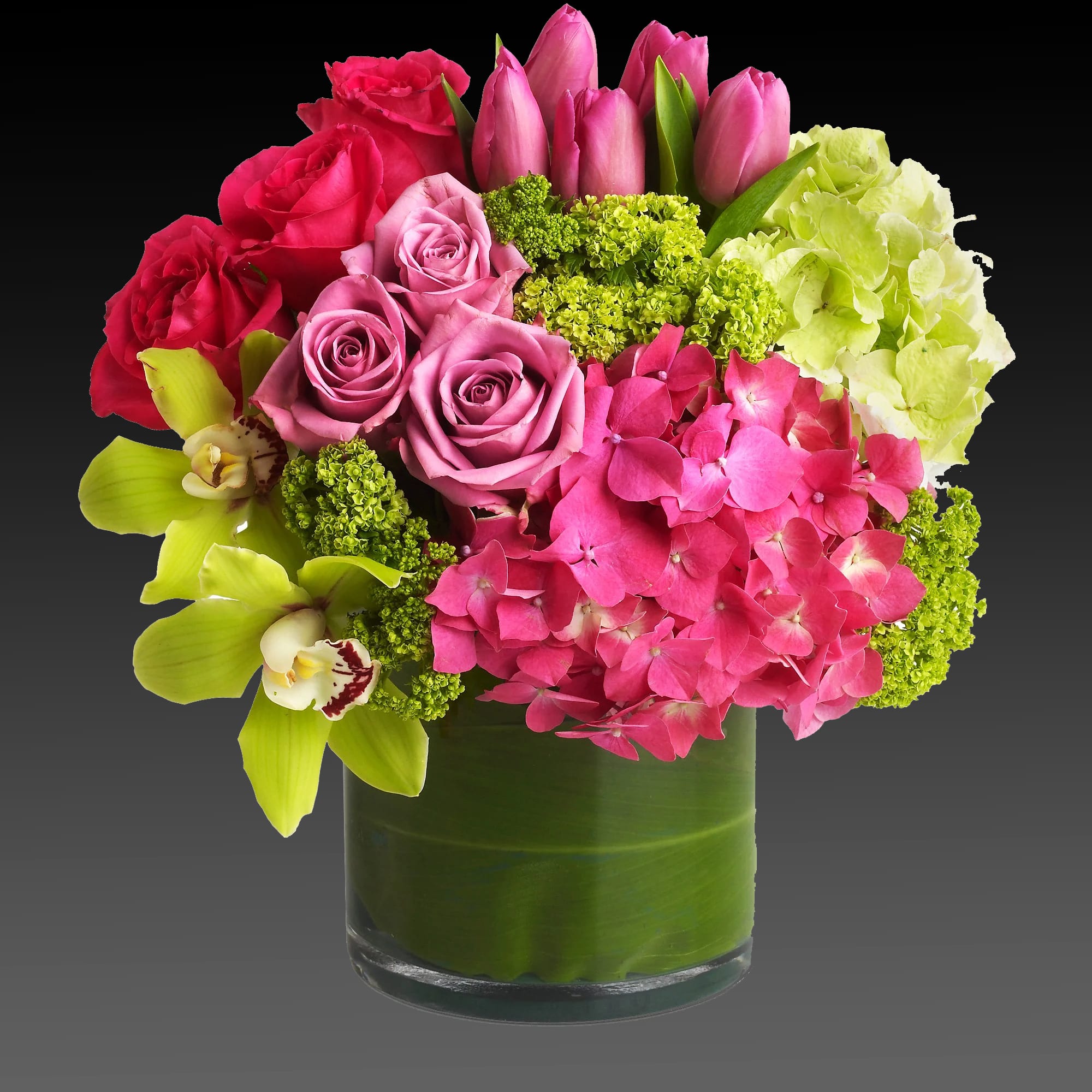 New Sensations  - Upscale and uptown. This fantastic arrangement is a beauty and a half to behold. Overflowing with gorgeous blossoms and delivered in a leaf-lined cylinder vase, it's truly a floral fantasy.  Green and pink hydrangeas, green cymbidium orchids, hot pink and lavender roses, tulips and more are beautifully arranged in a large clear glass cylinder vase.  Approximately 13&quot; W x 14&quot; H  Orientation: All-Around      As Shown : T82-3A     Deluxe : T82-3B     Premium : T82-3C  