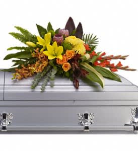 Island Memories Casket Spray Island Memories Casket Spray - Graceful and fresh, this tropical-influenced spray sheds light on memories that will be forever treasured. Splashed with color and grounded with earth tones, it lends comfort and hope to any memorial. Yellow asiatic lilies with orange orchids and roses, red gladioli, pink protea and yellow chrysanthemums are draped across the casket amidst radiating ferns, greens and leaves. Approximately 40" W x 22 1/2" H Orientation: N/A