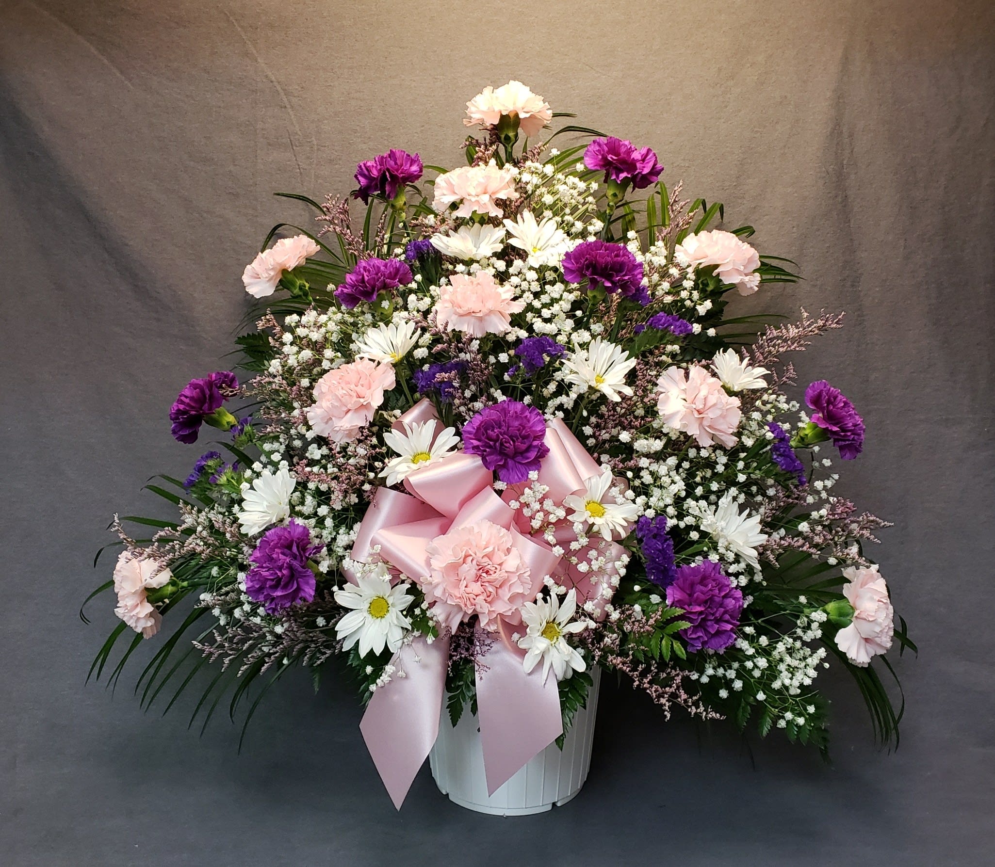 Purple/Pink/White Funeral Arrangement - Basic funeral arrangement full of beautiful carnations.
