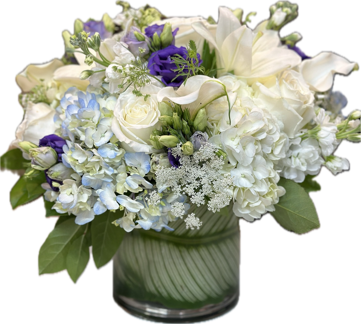 Sweet and Unique Sweet and Unique - A lovely low and compact arrangement with white, blue and purple.