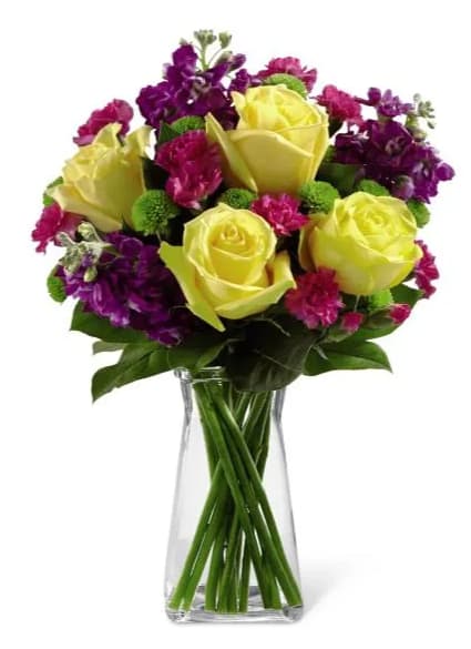 Happy times Happy times - Happy Times Bouquet employs roses and stock to bring vibrant color and fragrance straight to their door on their special day. Yellow roses, purple stock, green button poms, fuchsia mini carnations and lush greens create a stunning display beautifully arranged in a clear gathered square glass vase to help you convey your happy birthday wishes or send your congratulations.