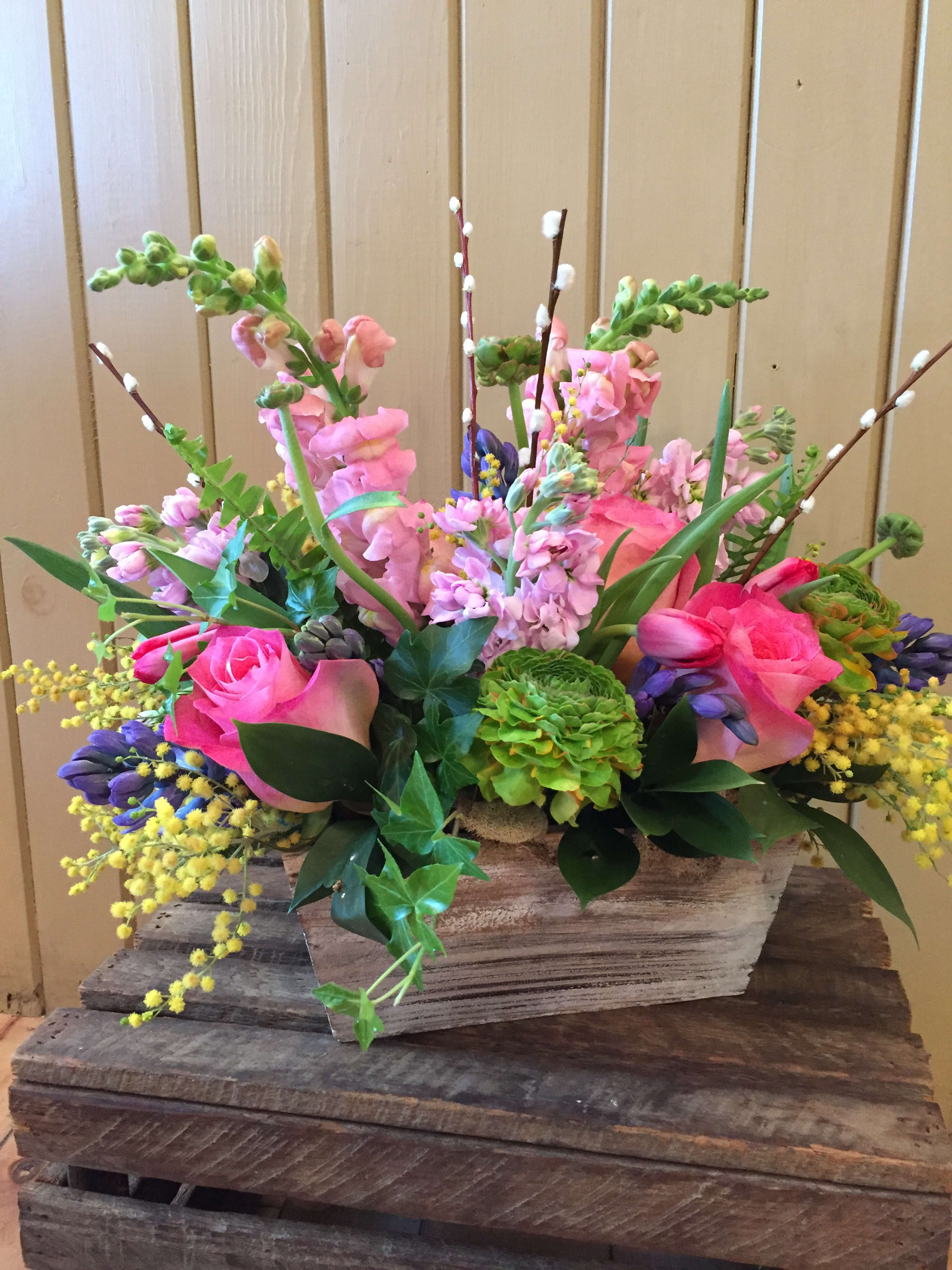 Spring Box - A springy mix of tulips, snapdragons, roses and hyacinths accented with fuzzy pussy willow branches.  This arrangement will have you thinking of warmer days.