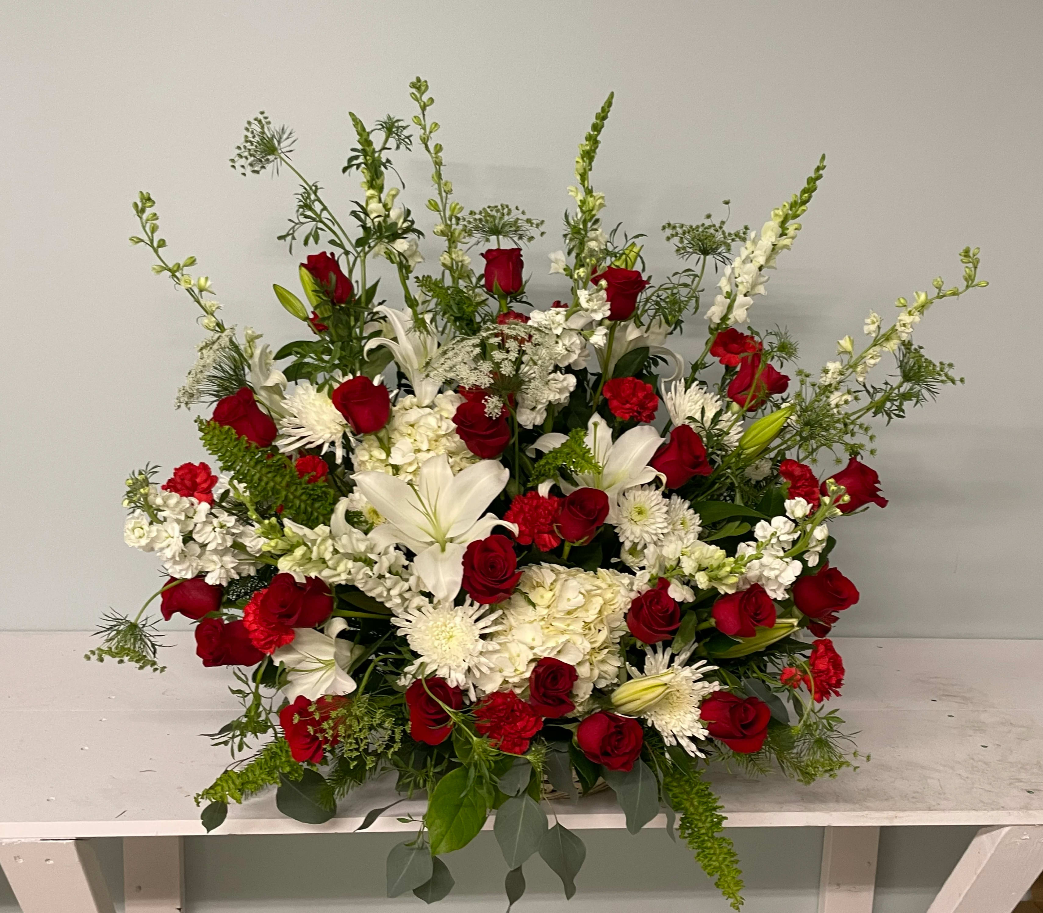 Red Touch Red Touch - A red and white arrangement to show you affection towards your loved ones. This arrangement is great for any event and colors can be changed upon request.
