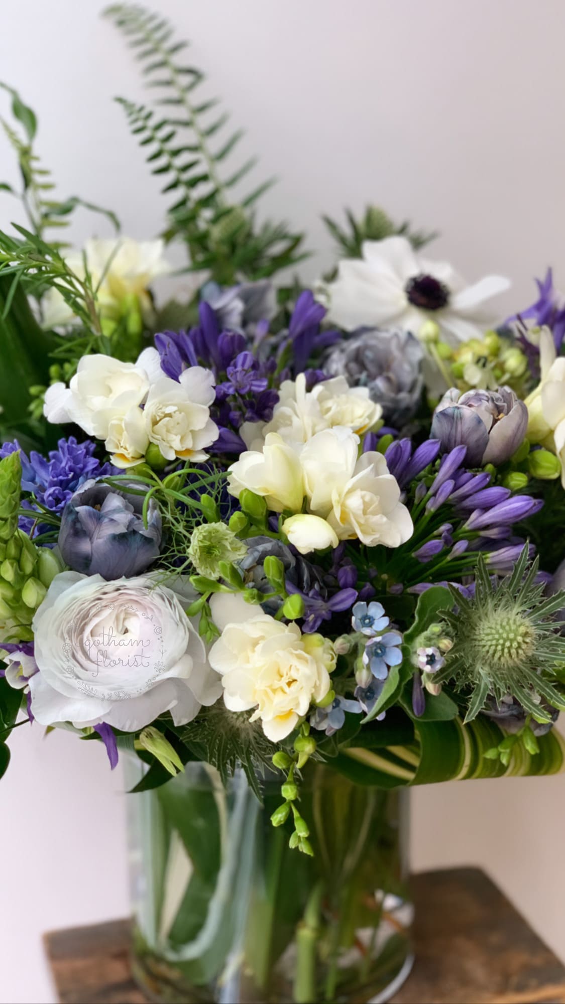 Blu - A beautiful mix of blue and whites florals. Pictured are thistle, iris and lisanthus. Cool and modern. Send the best flowers from the best flower shop in New York. We offer same day flower delivery in Manhattan, Queens, Bronx, Brooklyn, Staten Island and West Chester counties. We have the prettiest and most luxurious flowers to choose from and our designs are unique and whimsical. We carry Peonies almost every day of the year!!#mercuryvase #weddingflowers #luxuryflowers #ranunculus #peony #peonies #flowerdelivery #samedaydelivery