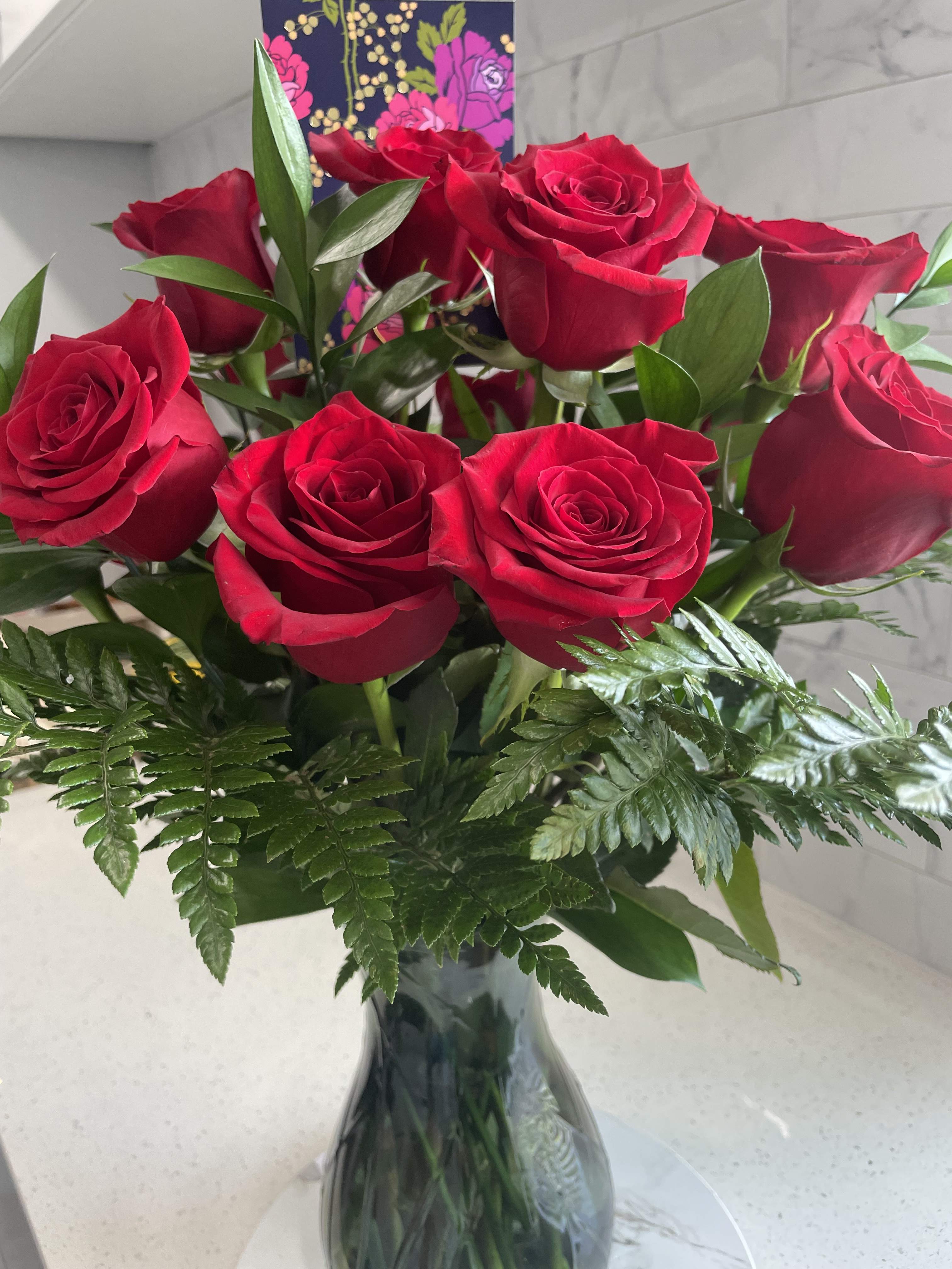 Dozen Long Stemmed Red Roses by BloomNation™ - These dozen red roses are the classic romantic gift! Perfect for Valentine's Day or an Anniversary.   APPROXIMATE DIMENSIONS: 25&quot; H X 18&quot; W  Each bloom is privately selected and chosen for each arrangement for quality control as well as having hydro dip solution for each stem for guaranteed freshness and hydration.