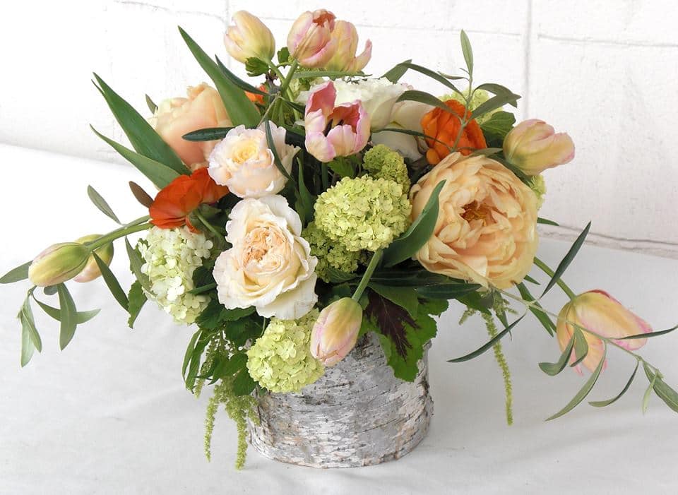 Wispy Garden - Escape the LA hustle and breathe in floral bliss with this free-flowing masterpiece from Dave's Flowers. Imagine fluffy hydrangeas in soft hues swirling around vibrant garden roses, cheerful tulips, and delicate ranunculus, all gracefully crowned by cascading amaranthus. Nestled in a natural birch container, this arrangement brings the beauty of a sun-drenched meadow right to your doorstep.  More Than Just Petals:  LA's Fresh Faces: We hand-pick every bloom from trusted Los Angeles growers, ensuring vibrant colors, intoxicating fragrances, and long-lasting freshness. Artisan Handcrafted: Our skilled Los Angeles florists weave their magic, capturing the essence of nature in every flowing curve and petal arrangement. From Birthday Blooms to &quot;Just Because&quot;: This versatile bouquet speaks volumes for birthdays, anniversaries, congratulations, or simply brightening someone's day. Blooming Convenience:  Skip the LA traffic: Let us bring the garden to your loved ones. We offer convenient Los Angeles flower delivery, brightening their day with same-day or scheduled options. A Natural Touch: The rustic charm of the birch container adds a unique and eco-friendly element to this stunning arrangement. Sustainable Beauty: We care about our planet and source flowers responsibly, ensuring your gift brings joy not just to your loved ones, but to the environment too. Ready to embrace the floral freedom? Contact Dave's Flowers today and let us bring a touch of sun-kissed meadow magic to your Los Angeles moments.