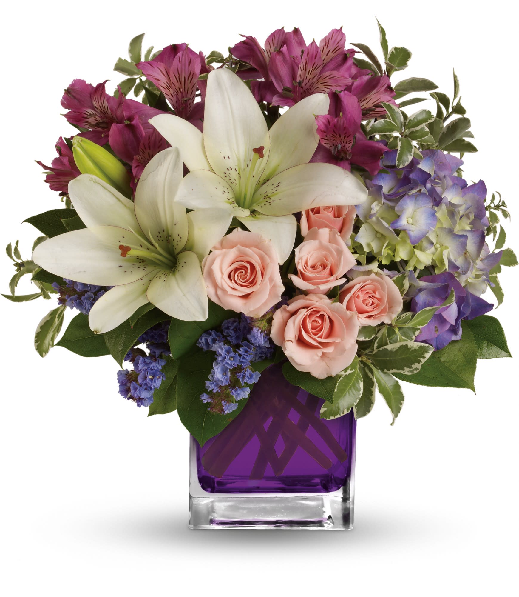 Garden Romance - Hello, gorgeous! This lovely bouquet includes purple hydrangea, light pink spray roses and white asiatic lilies arranged in our vibrant violet glass cube. 