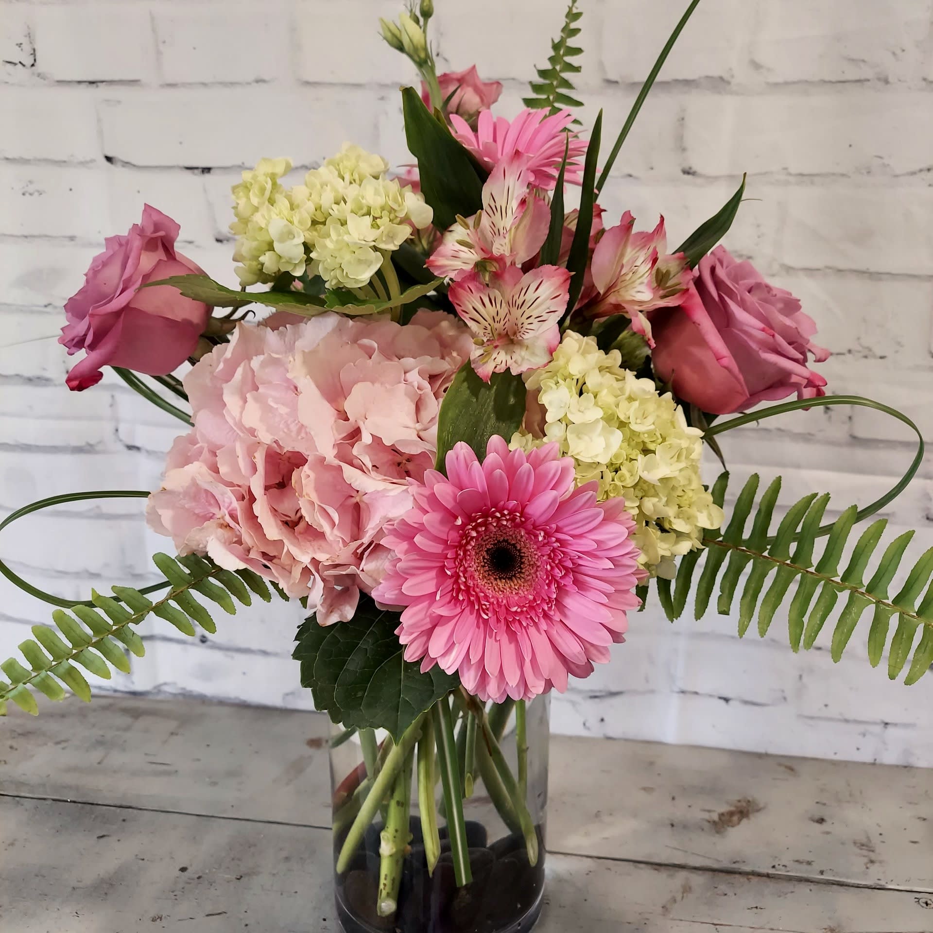 Sunshine & Blooms Sunshine & Blooms - These blooms will make any day a sunny day. Soft pinks, whites and greens are sure to brighten your day!