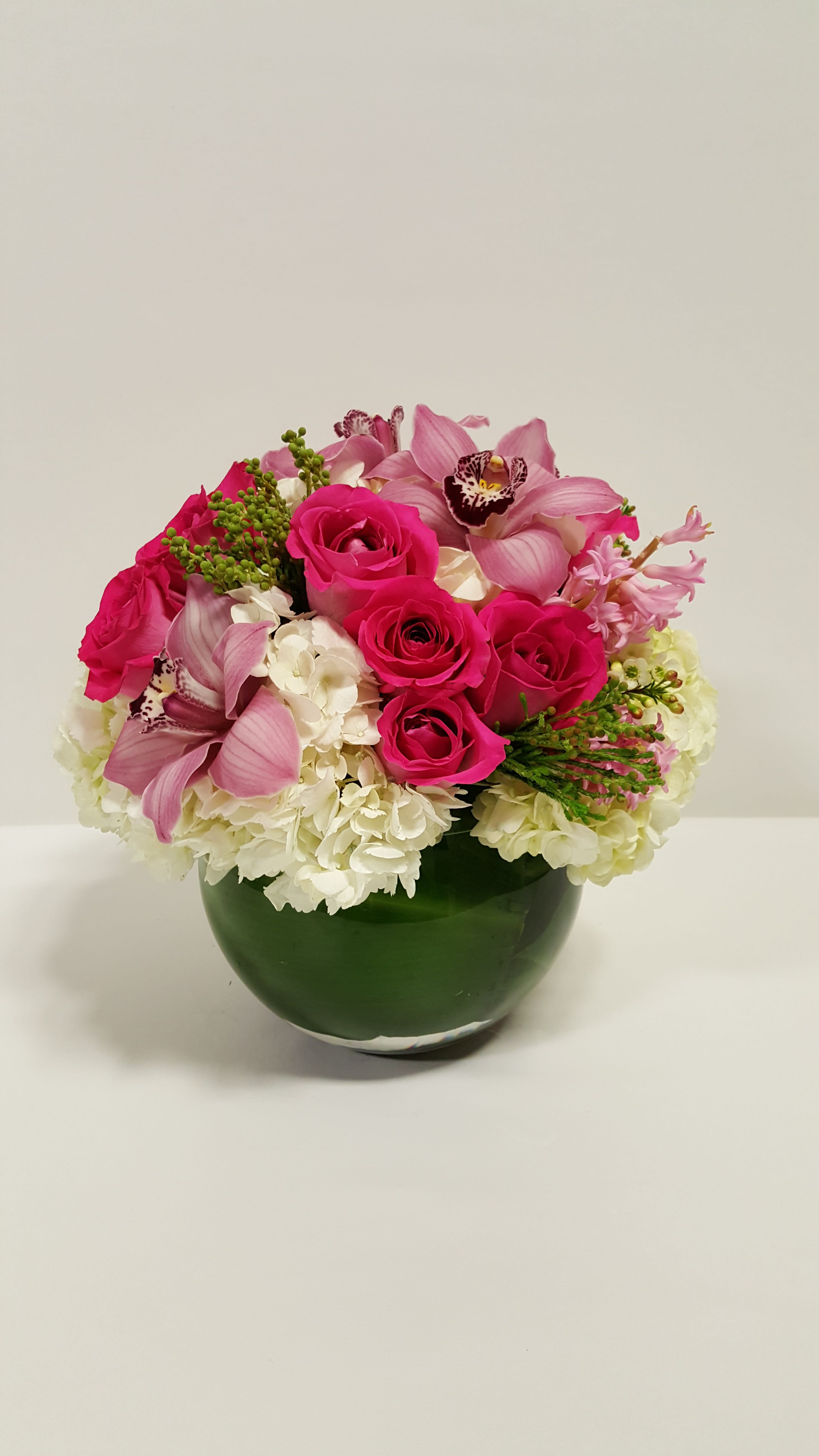 The Sweet Perfection - fish bowl vase with some nice white hydrangeas combined with lovely pink roses and pink cymbidium and pink  hyacinth  Perfect for  birthday flowers anniversary flower  just because flowers  congratulations flowers  Get well flowers  Christmas flowers Valentines Day flowers Mother's Day flowers