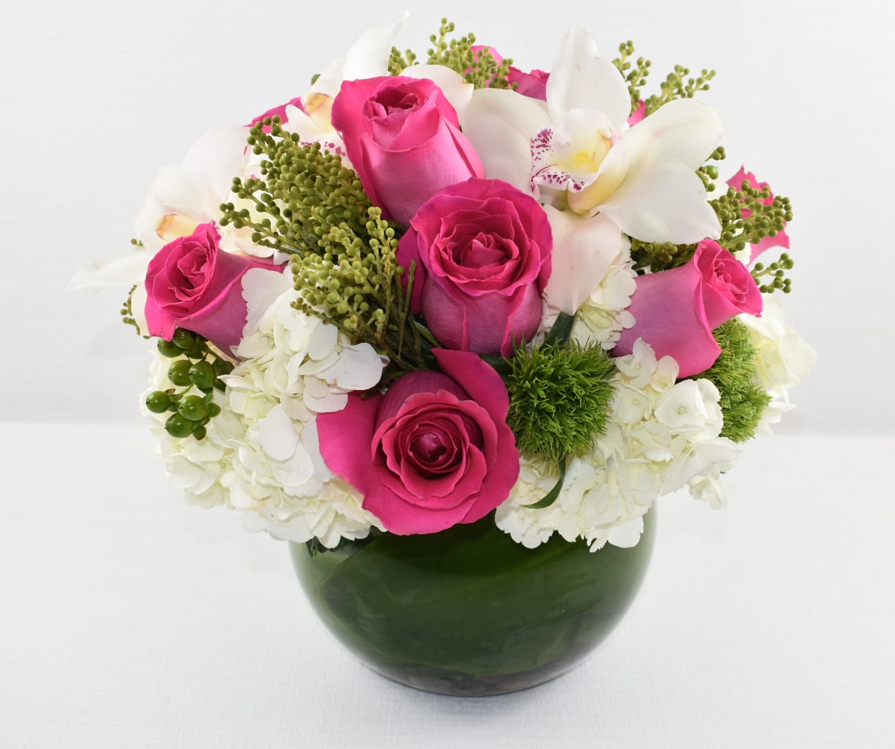 Her Majesty  - Her Majesty is a floral arranged with white hydrangeas hot pink Ecuadorian roses perfectly combined with unique greenery and just to make it even more perfect it contains white cymbidium orchids  This floral is perfect for any occasion   Perfect for  birthday flowers anniversary flower  just because flowers  congratulations flowers  Get well flowers  Christmas flowers Valentines Day flowers Mother's Day flowers