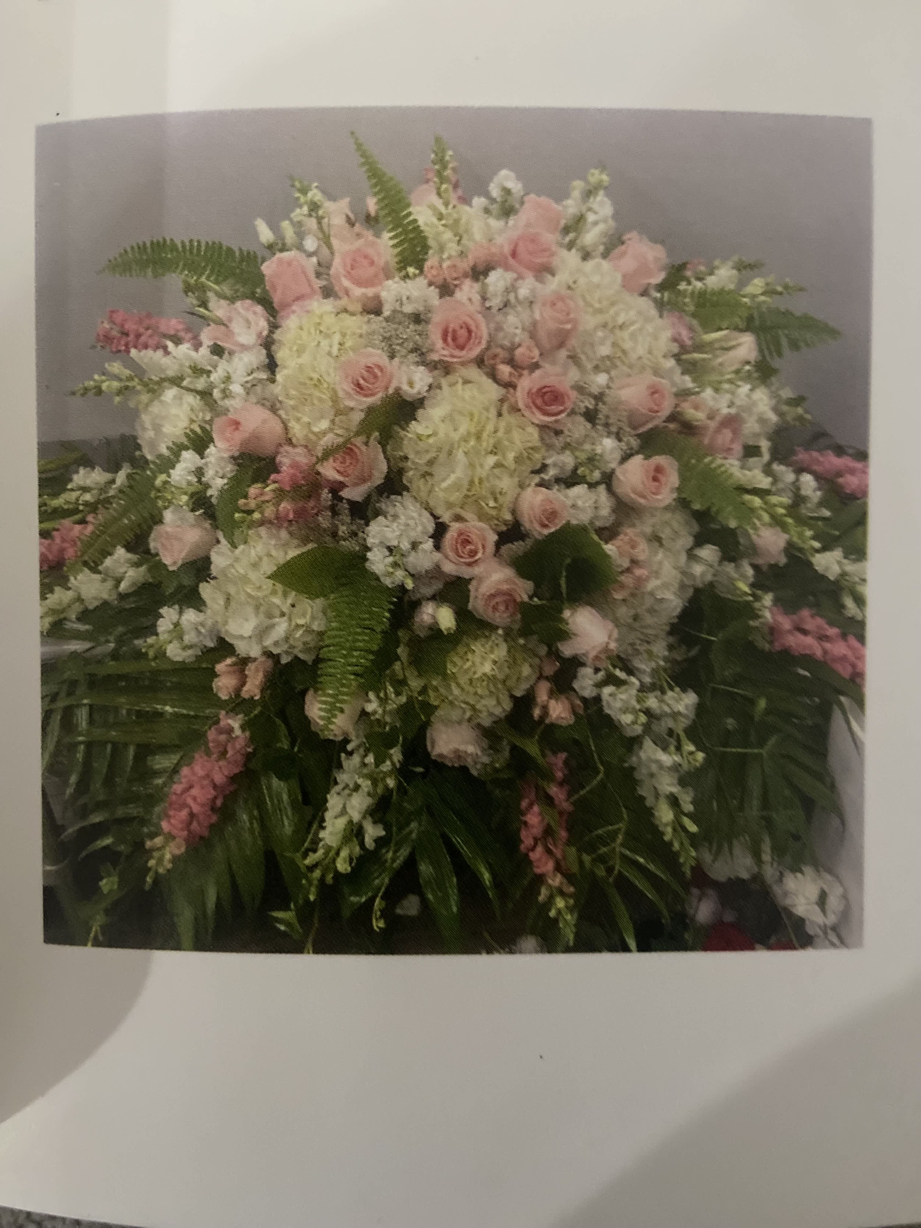 Pretty in Pink Casket Spray Pretty in Pink Casket Spray - Roses , Snapdragons , Hydrangea , Stock , Carnations , Lush Greens